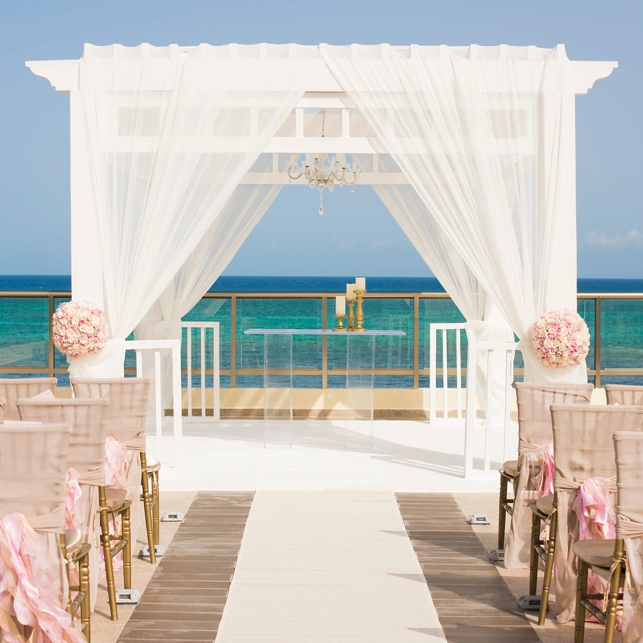 Experience a breathtaking wedding ceremony on a balcony with a view of the ocean. Enjoy a free destination wedding like no other.