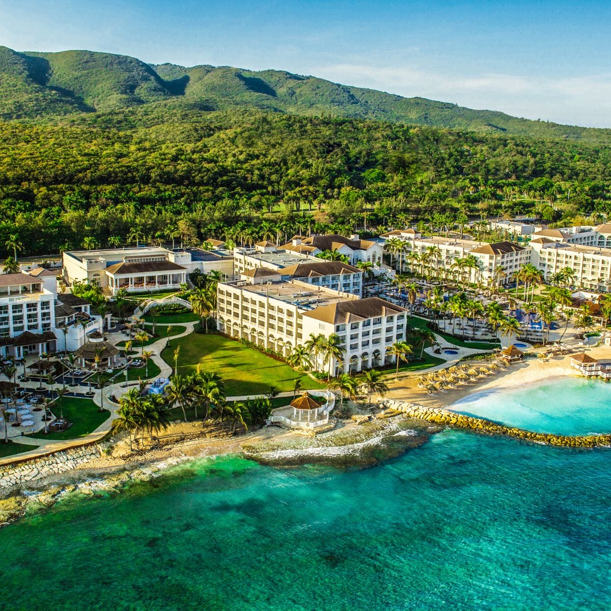 Aerial view of a stunning Jamaica destination wedding venue, beautifully located beside the sea.