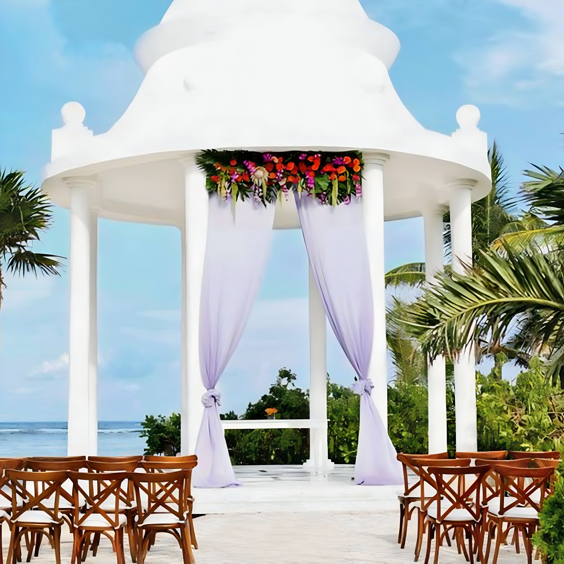 Tall, white, elegant, beach gazebo wedding at Grand Palladium White Sand