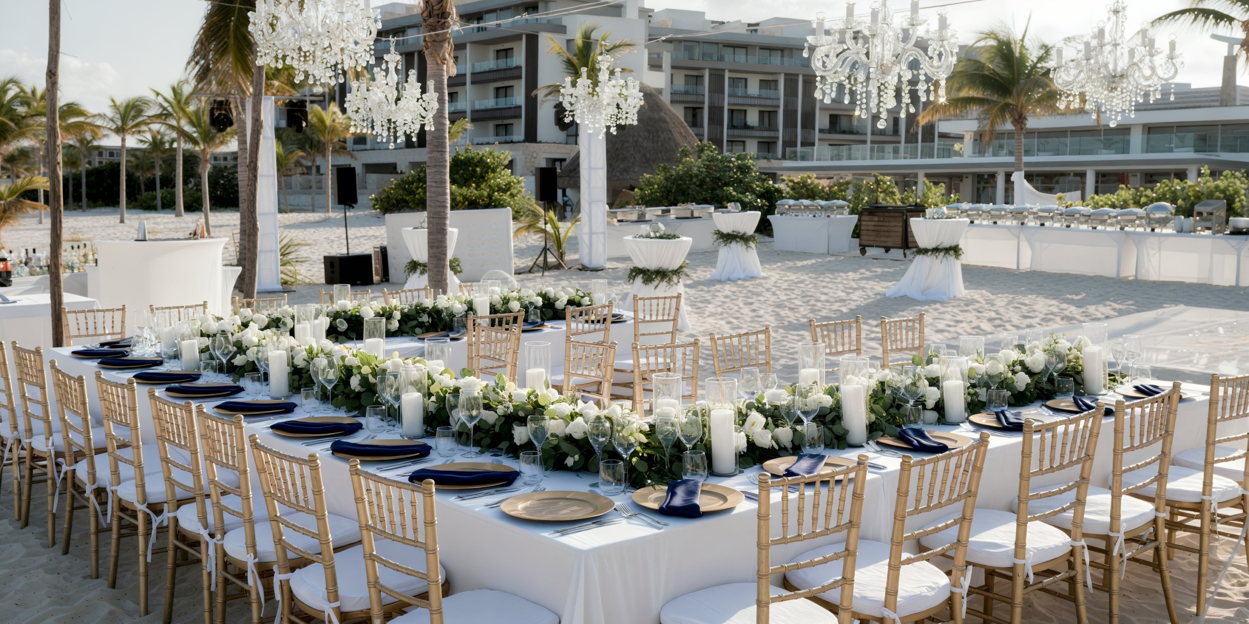 Destination wedding reception at Majestic Elegance Costa Mujeres with white tables and floral decorations.