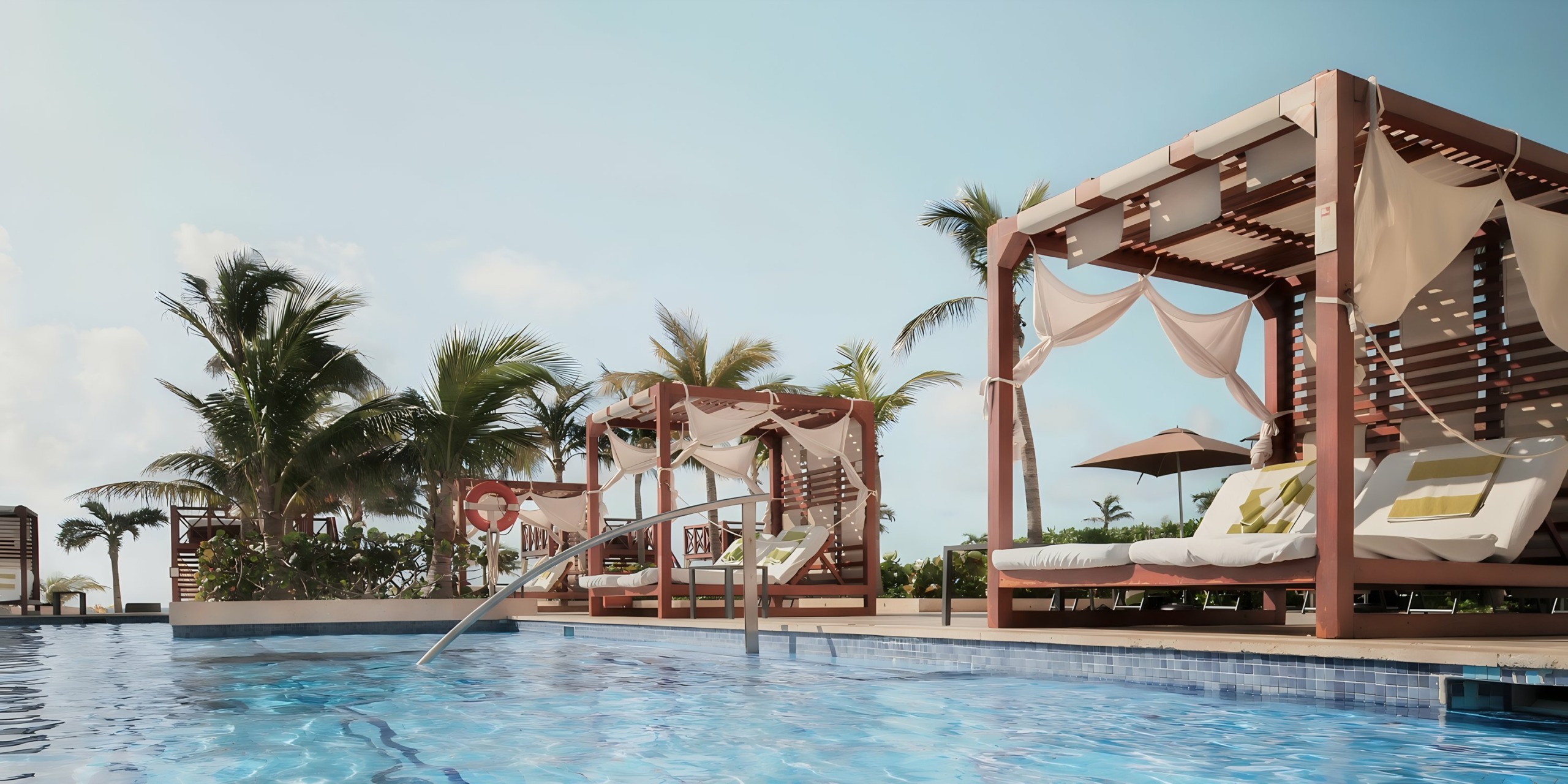 Luxury poolside area with modern cabanas and sun loungers at Hyatt Ziva Cancun.