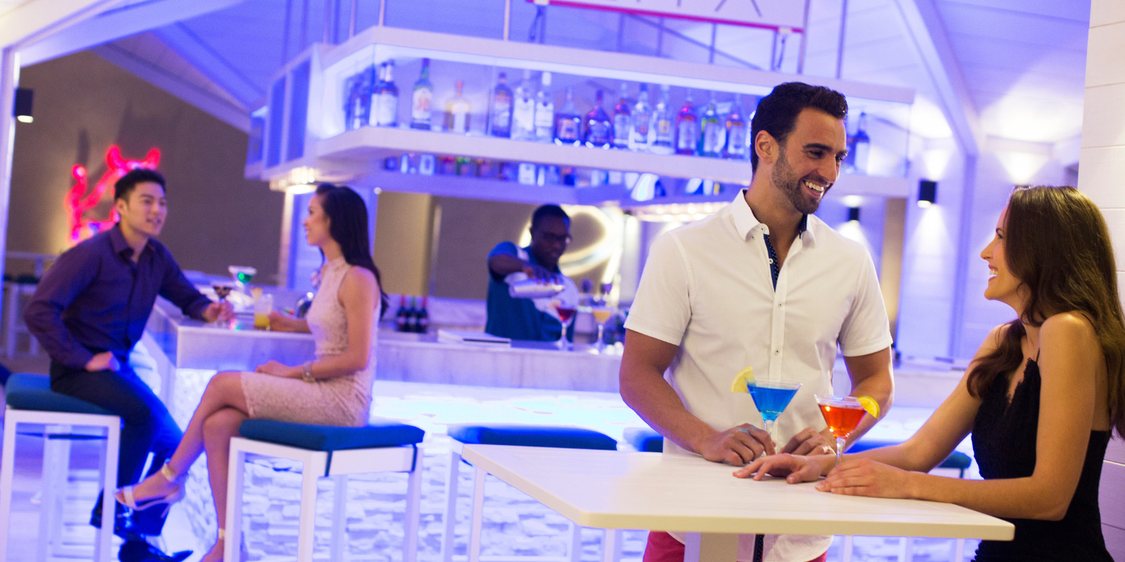 A group of people sitting at Royalton Blue Waters during a wedding.