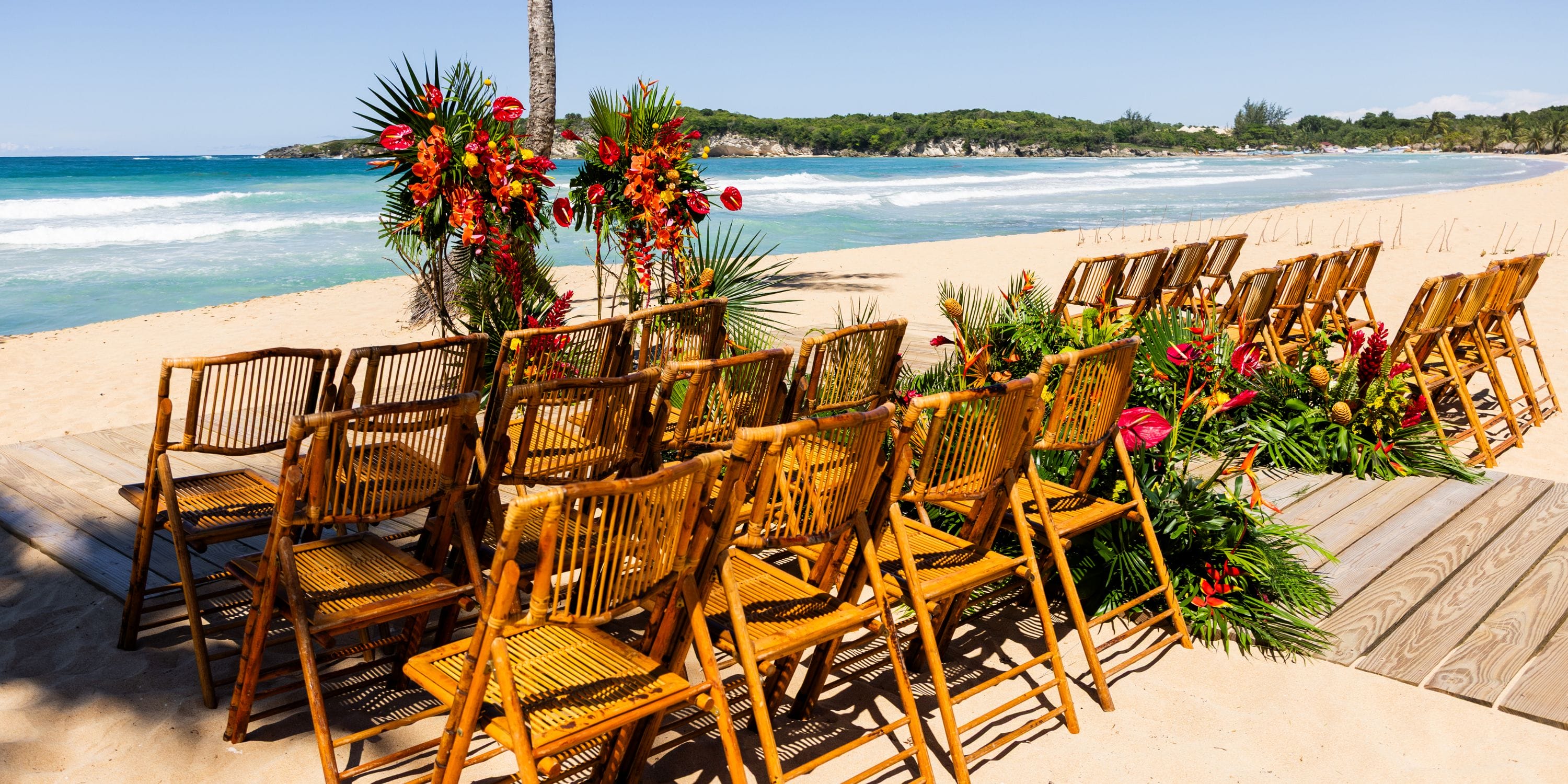 Dreams Macao Beach showcases bamboo chairs and floral decor for a stunning destination wedding ceremony.