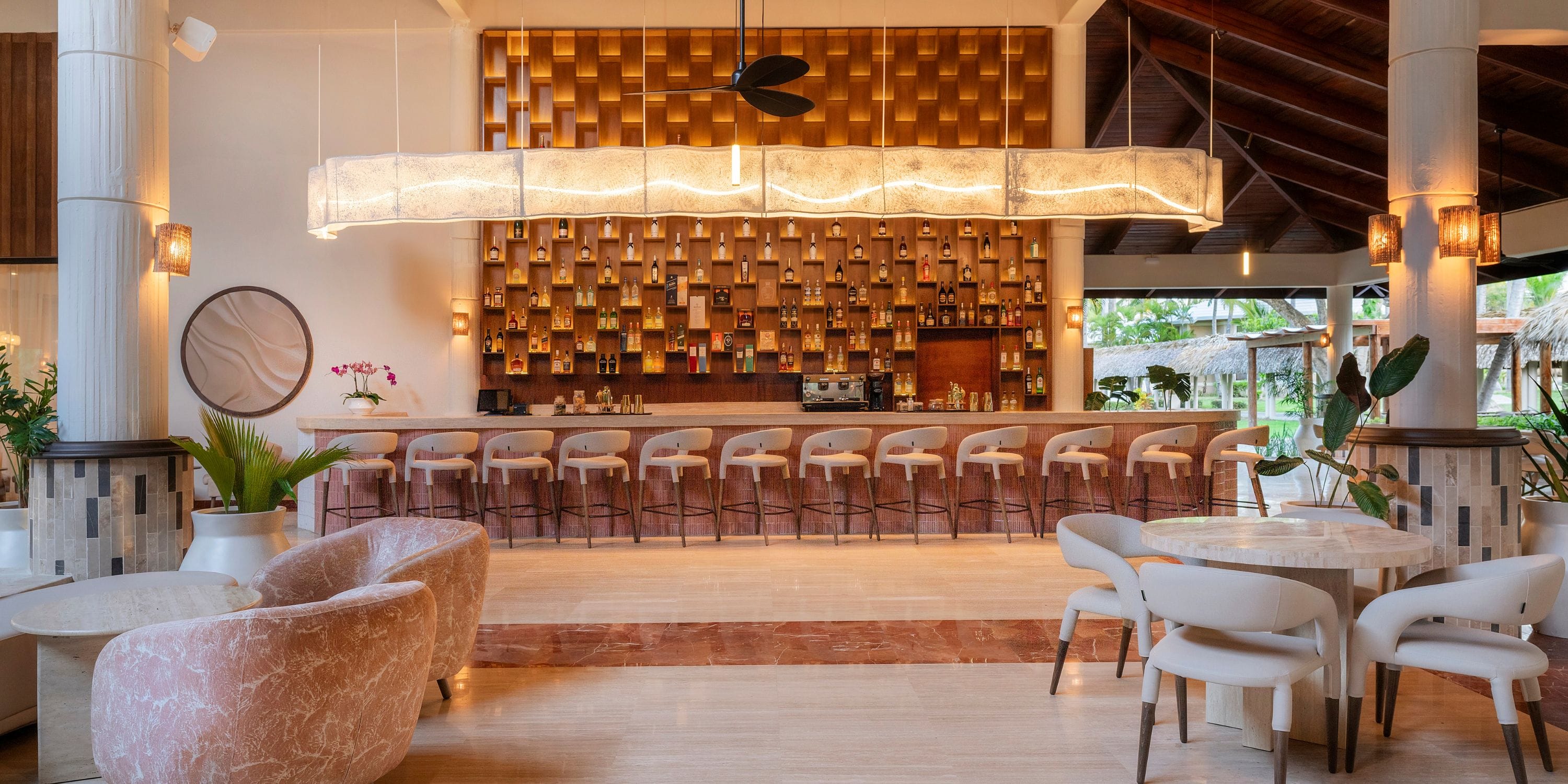 Grand Palladium Bavaro’s bar, ideal for a destination wedding, has marble seats and wood accents.