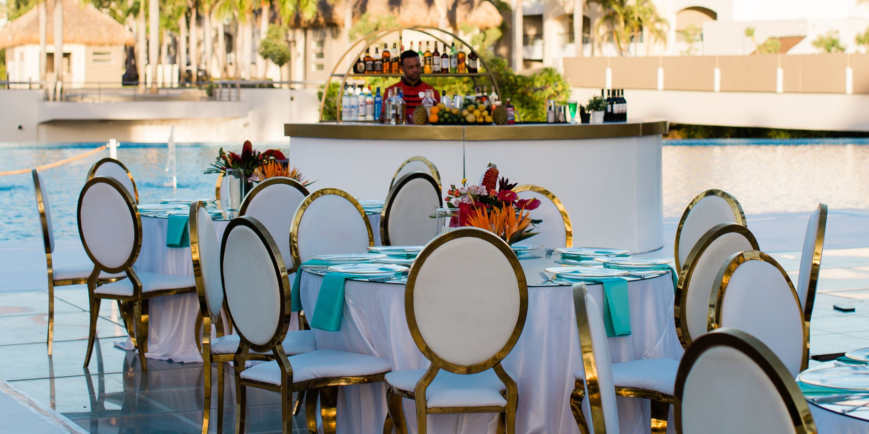 Outdoor dining setup with round tables and chairs at Hard Rock Punta Cana, perfect for a destination wedding.