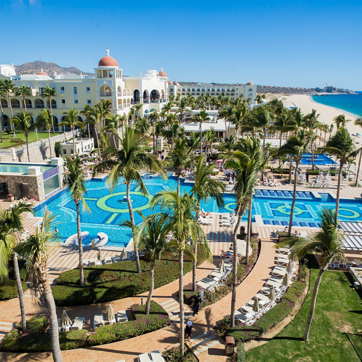 Hotel Riu Palace Cabo San Lucas, ideal for a destination wedding, offers pools and palm-lined sandy beaches.