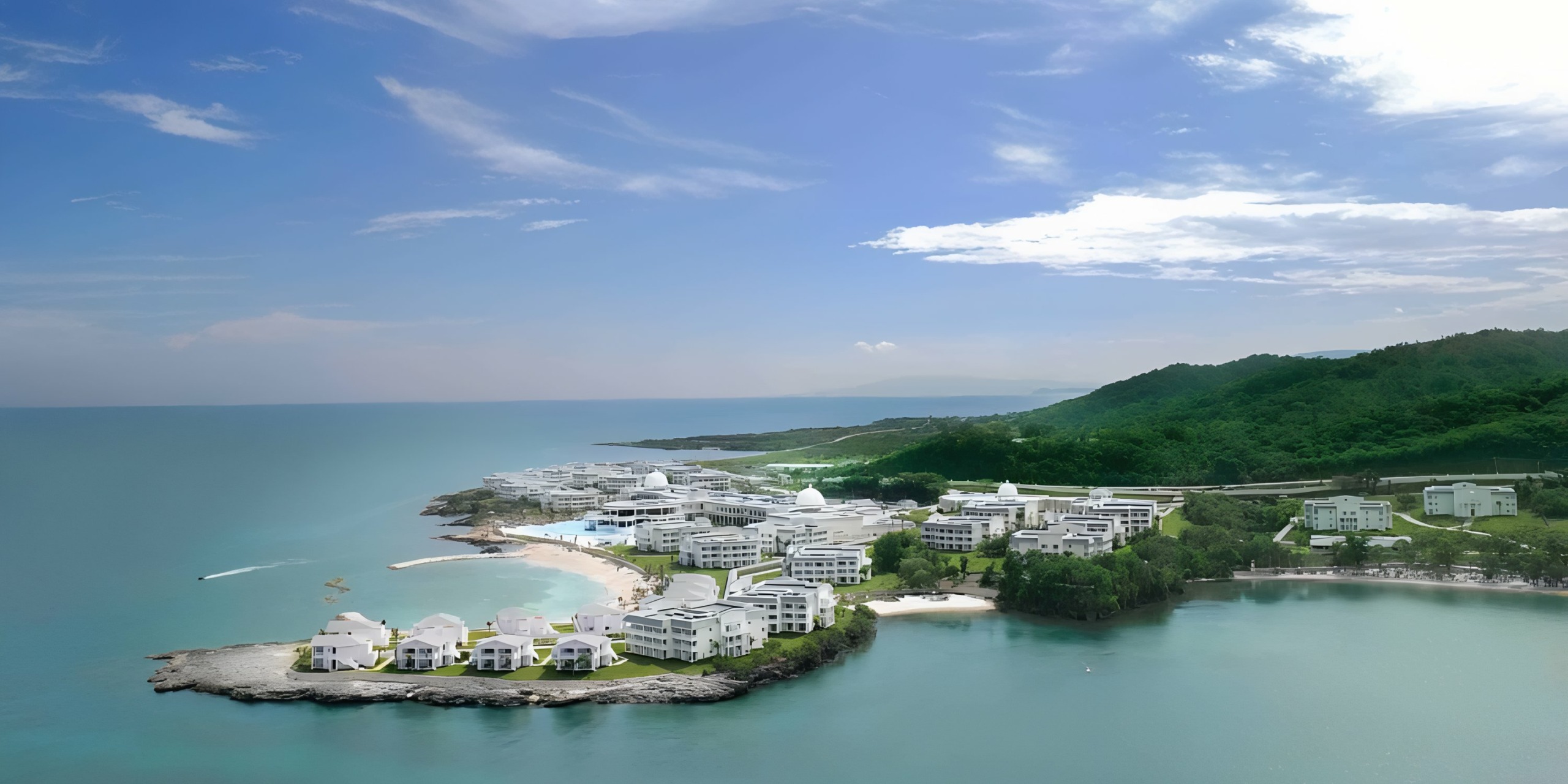 Coastal resort with white buildings beside a turquoise sea, perfect for a Grand Palladium Lady Hamilton wedding.