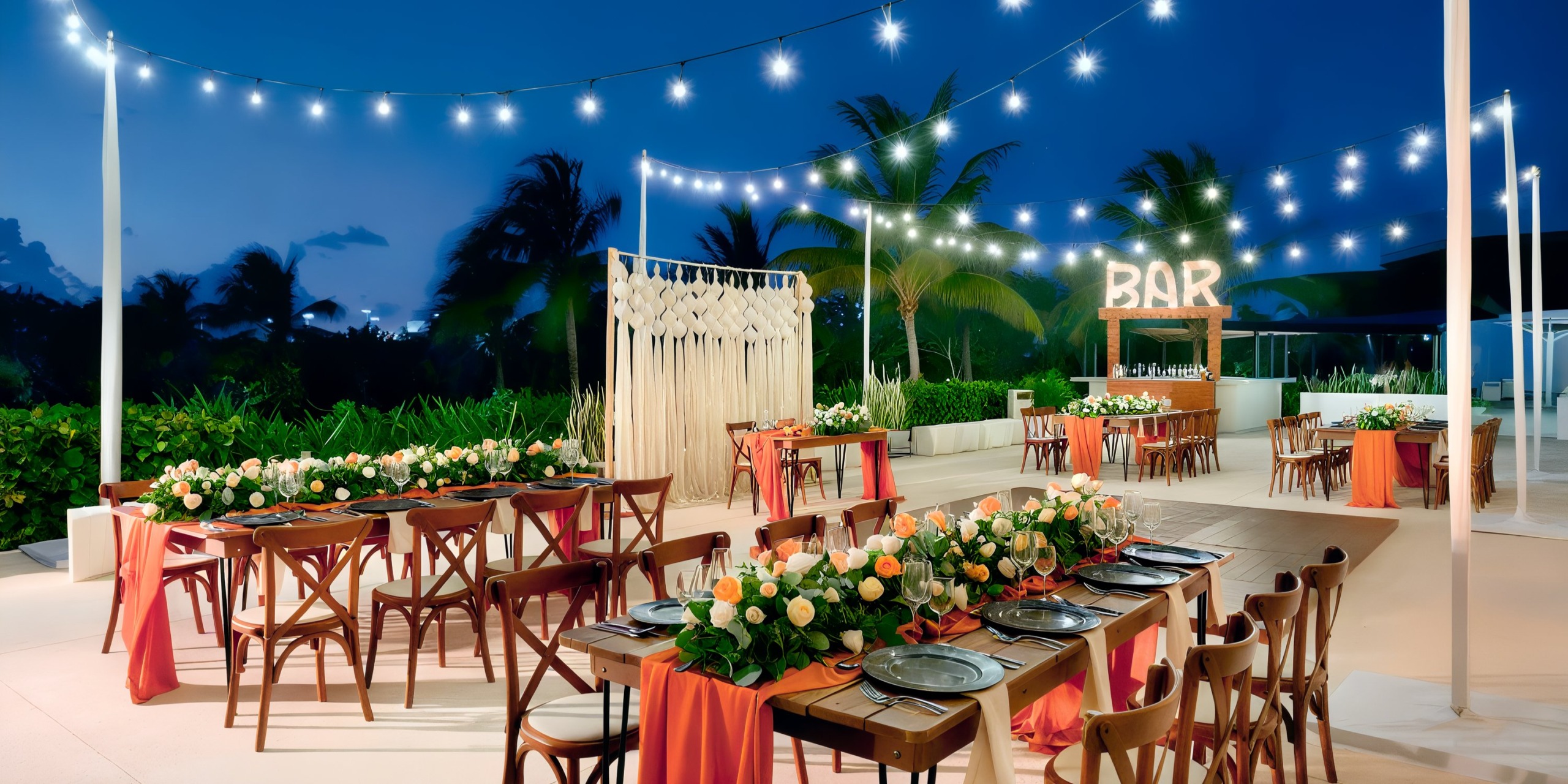 Experience an outdoor evening event at Grand Palladium Costa Mujeres, featuring string lights, elegantly decorated tables with floral centerpieces, and a well-stocked bar, all set under a clear sky.