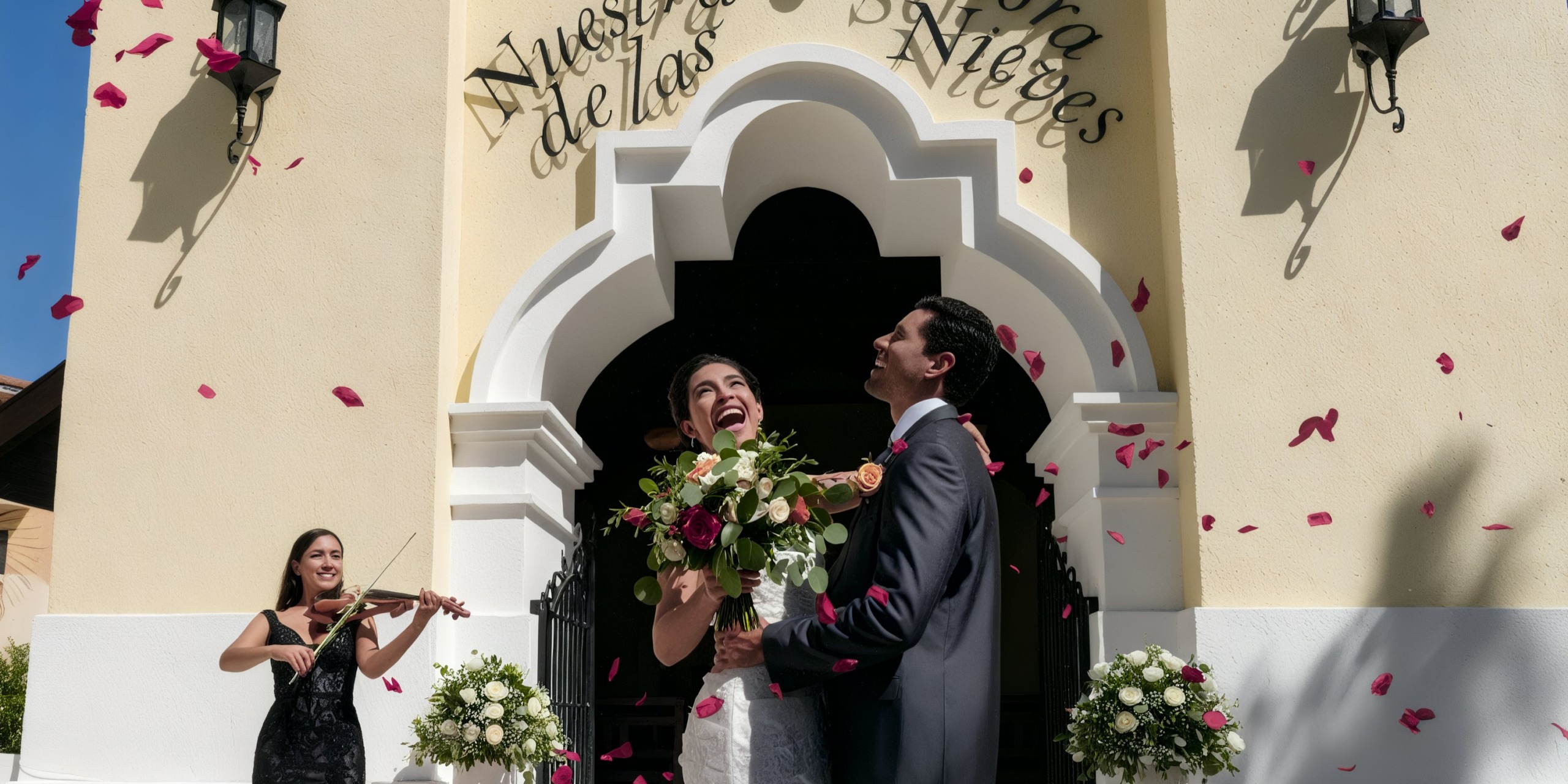 Under the picturesque archway at the Grand Palladium Vallarta, a bride and groom are serenaded by a violinist as rose petals gently cascade around them.