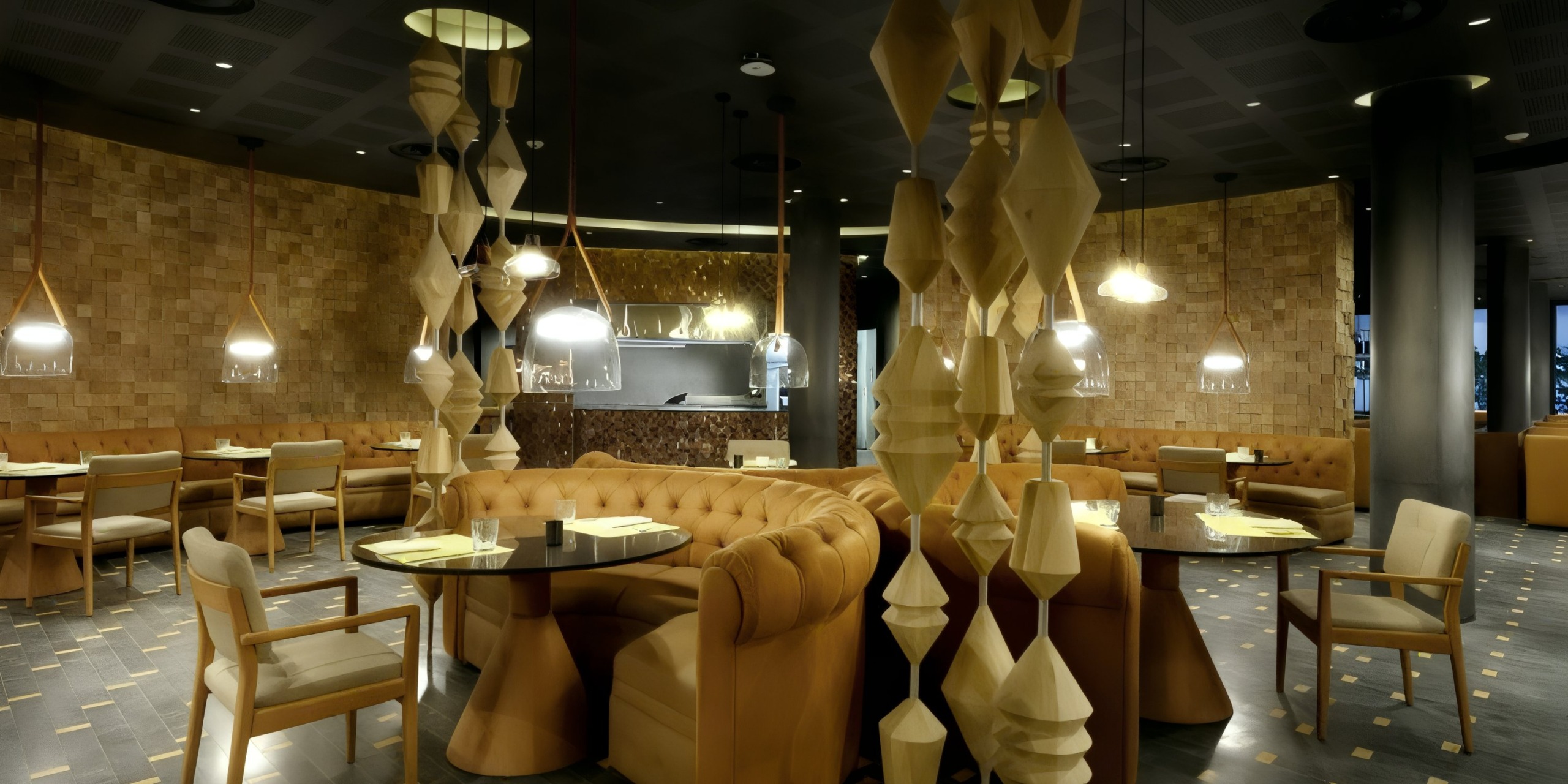 The interior of the Grand Palladium Costa Mujeres features tan leather seating, wooden tables, and decorative hanging sculptures. Dim lighting sets a cozy atmosphere.
