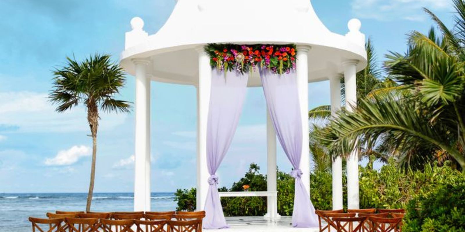 Tall, white, elegant, beach gazebo wedding at Grand Palladium White Sand