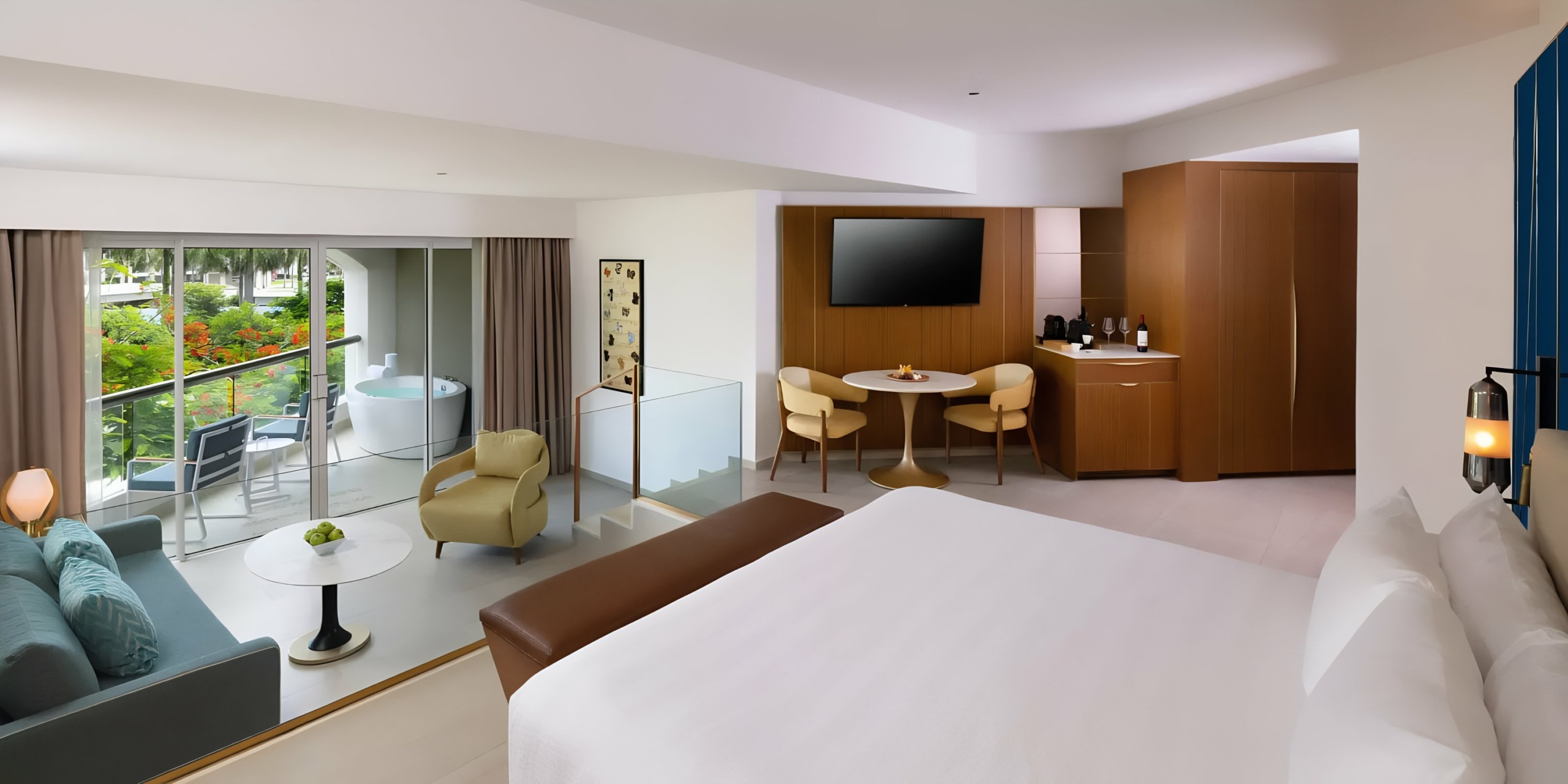 Modern Hard Rock Punta Cana hotel room interior with a view of the balcony and garden.