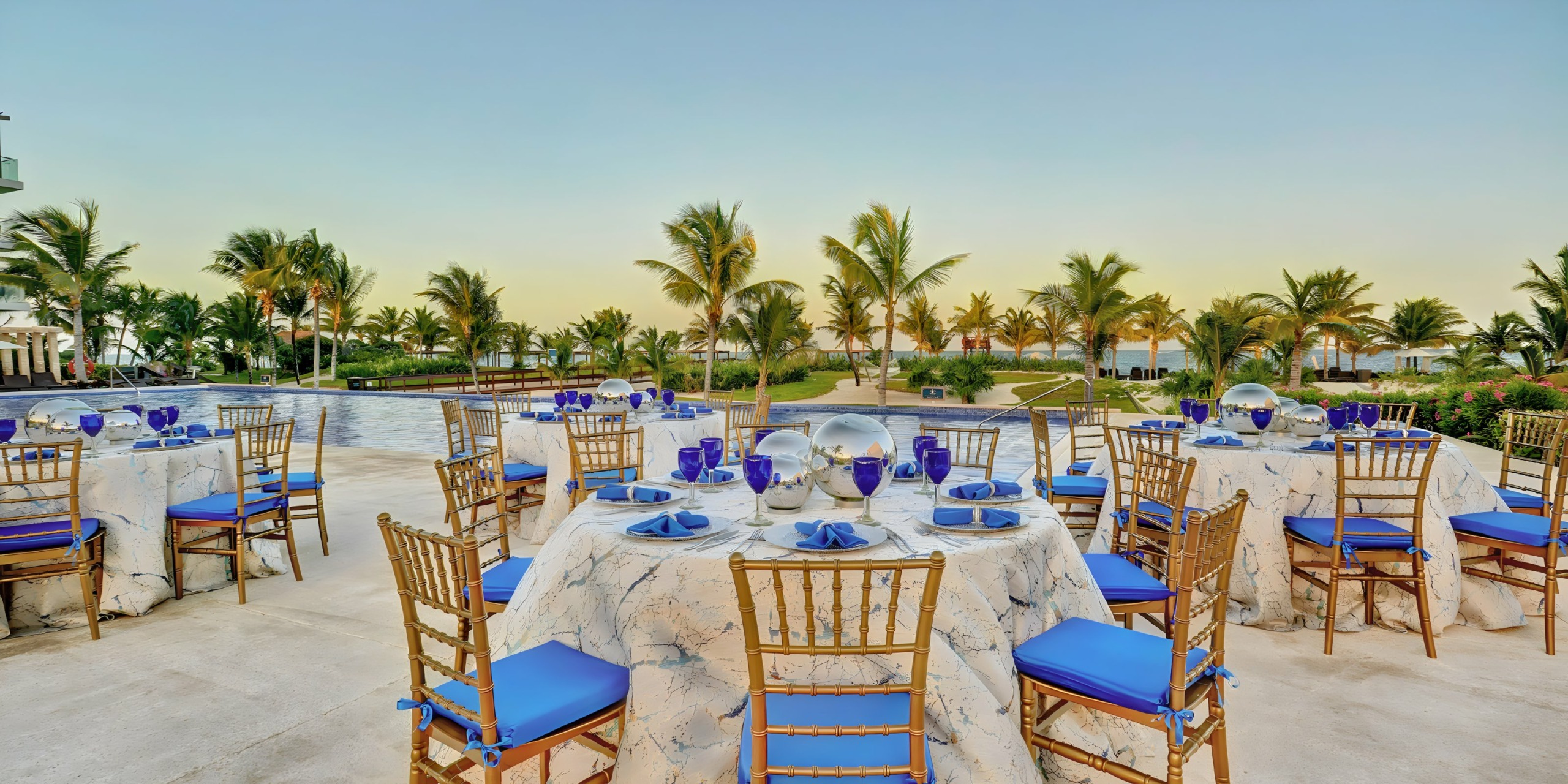 Poolside Royalton Riviera Cancun destination wedding reception dinner venue