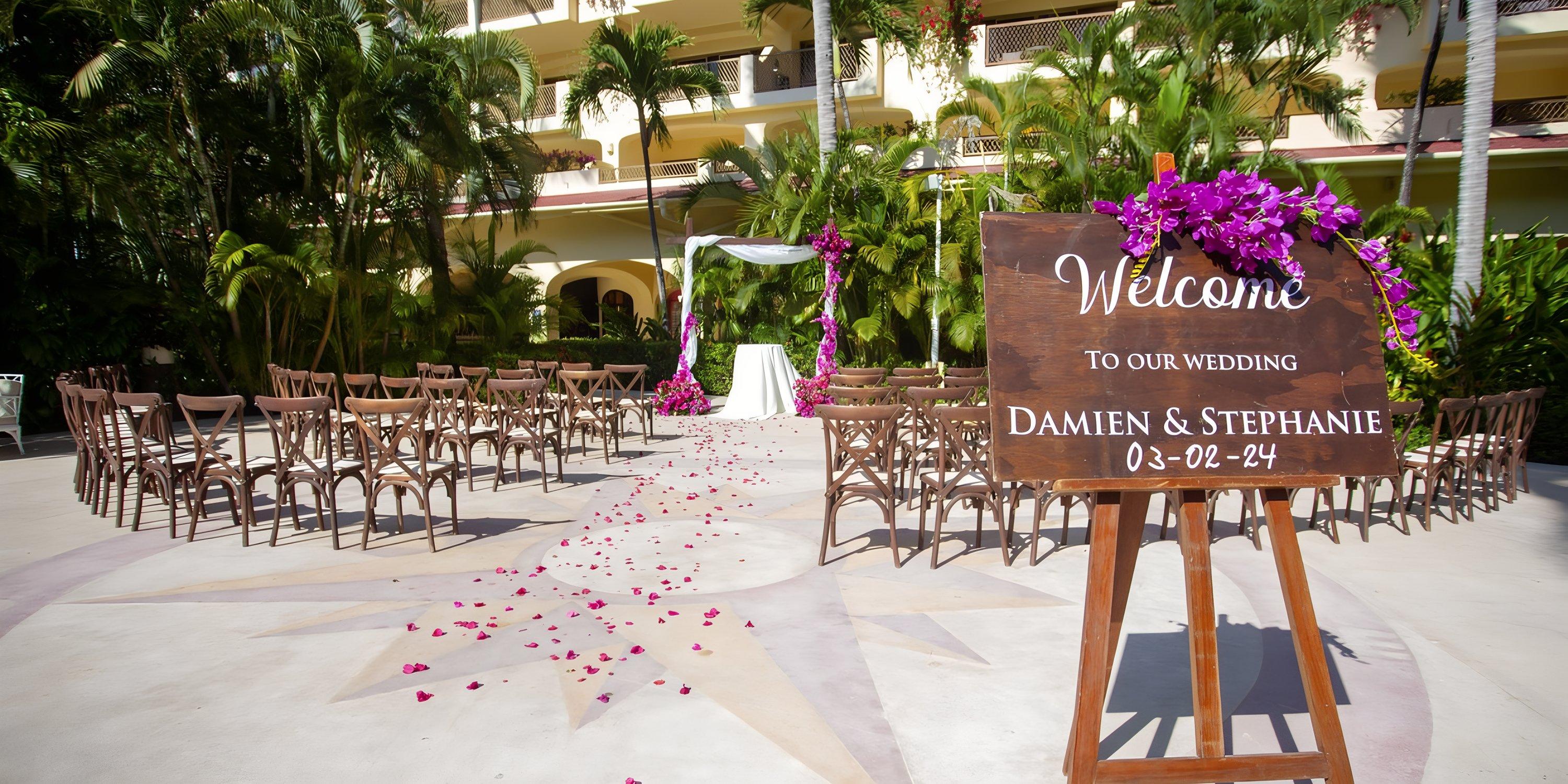 Destination wedding setup outdoors at Barcelo Puerto Vallarta for Damien and Stephanie.