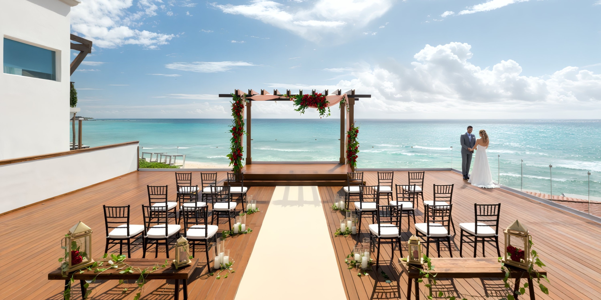 Hilton Playa del Carmen set up for a destination wedding, featuring a couple gazing out over the ocean.