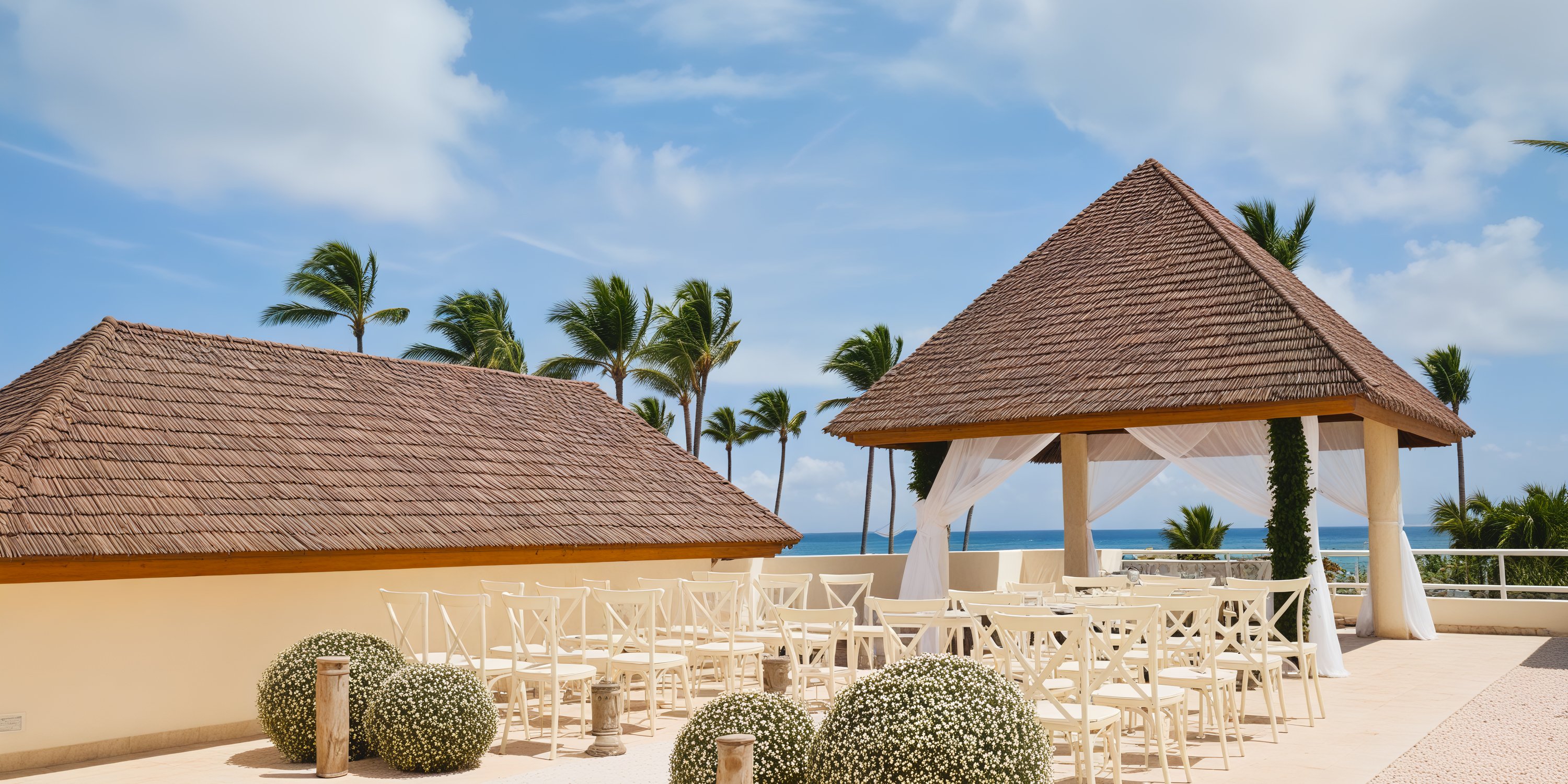 Dreams Royal Beach Punta Cana: An oceanfront destination wedding venue featuring a gazebo, chairs, and palm trees.