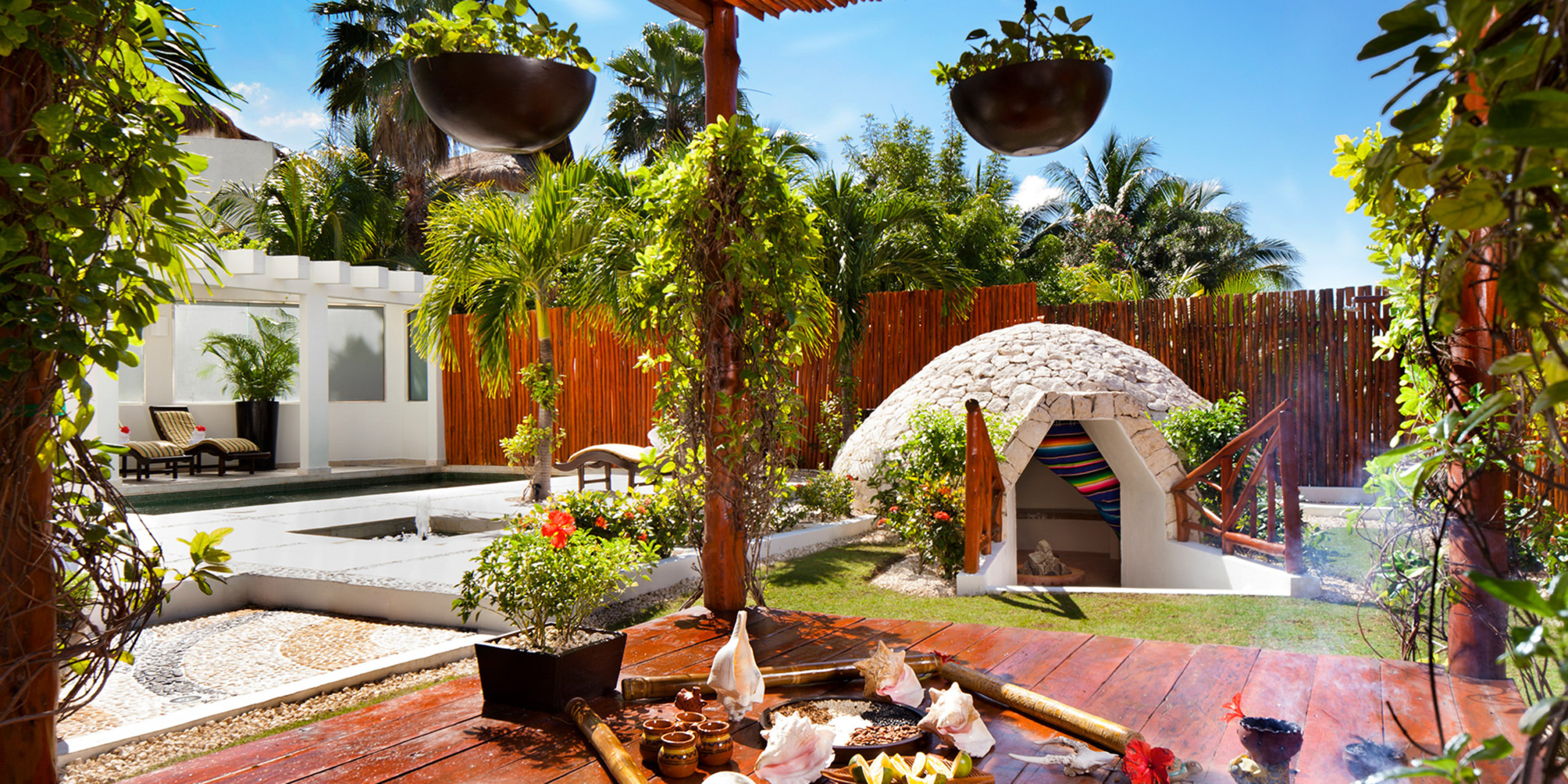 El Dorado Casitas Royale's resort grounds with a garden
