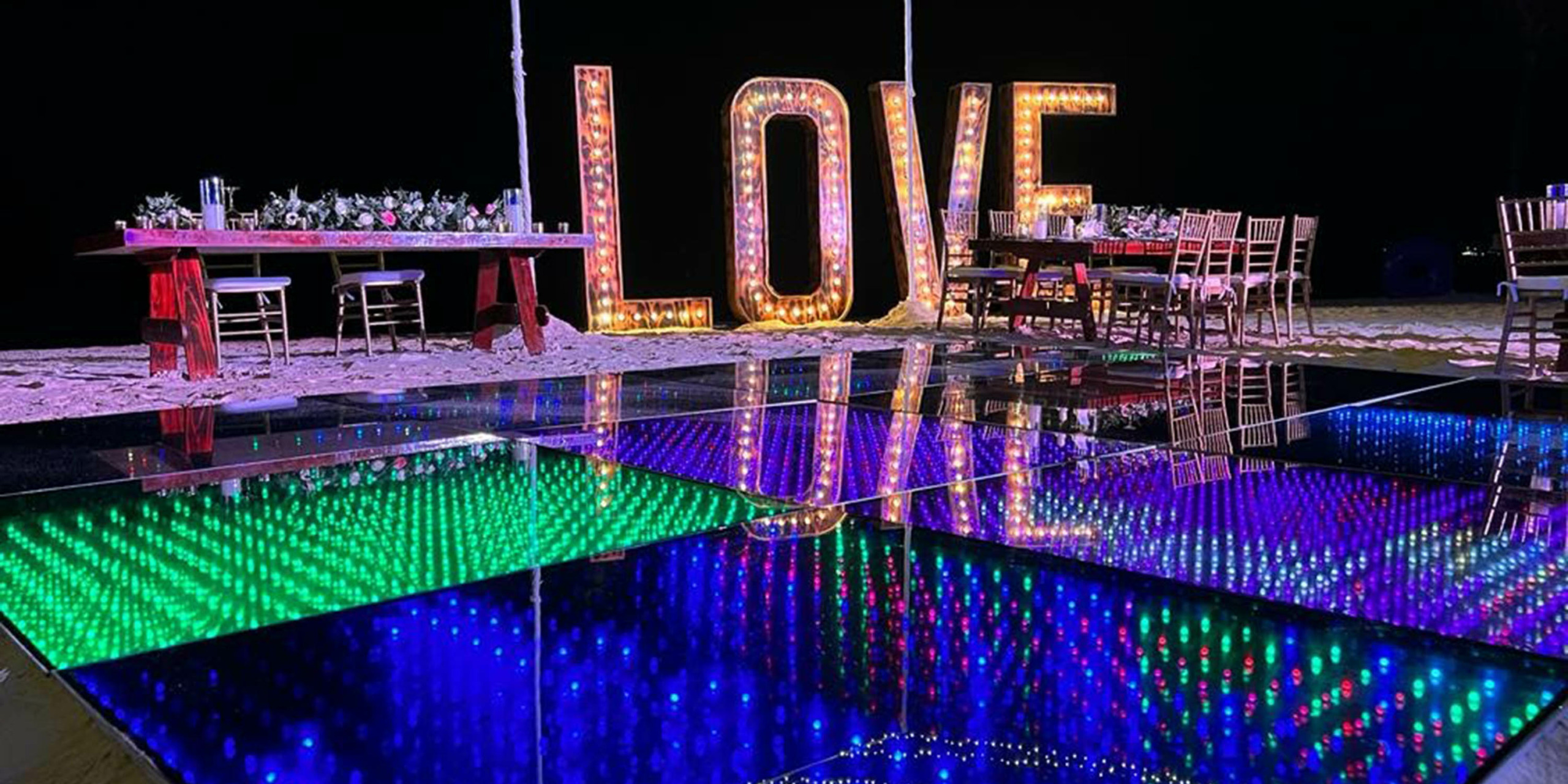 A dance floor with the word Breathless Riviera Cancún Resort & Spa on it.
