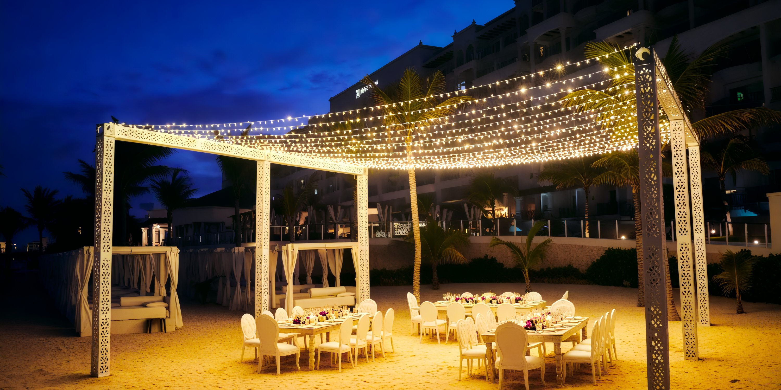 Hyatt Zilara Cancun offers enchanting beachside dining under the glow of string lights at night, making it a perfect setting for a romantic destination wedding.