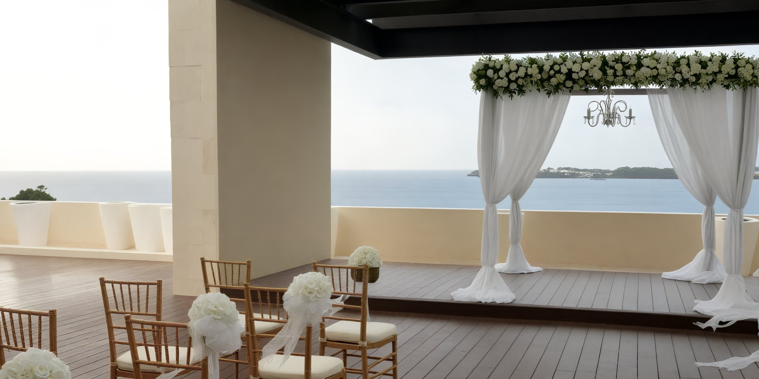 Wedding arch and chairs at Hideaway at Royalton Negril with a breathtaking sea view and beautiful floral arrangements, perfect for a destination wedding.