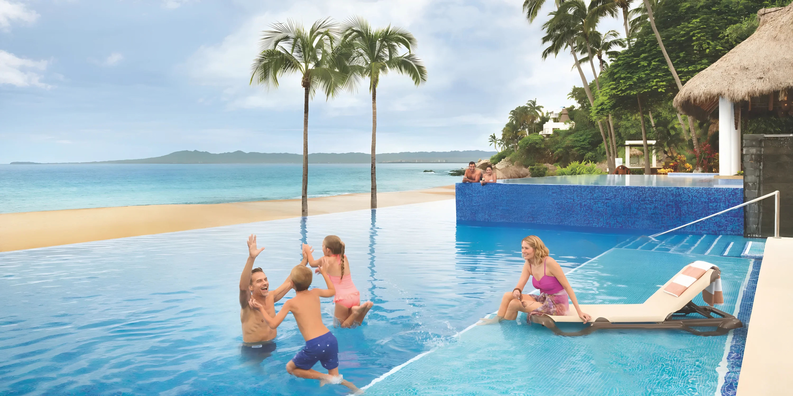 Hyatt Ziva Puerto Vallarta by the beach with people enjoying a sunny day.