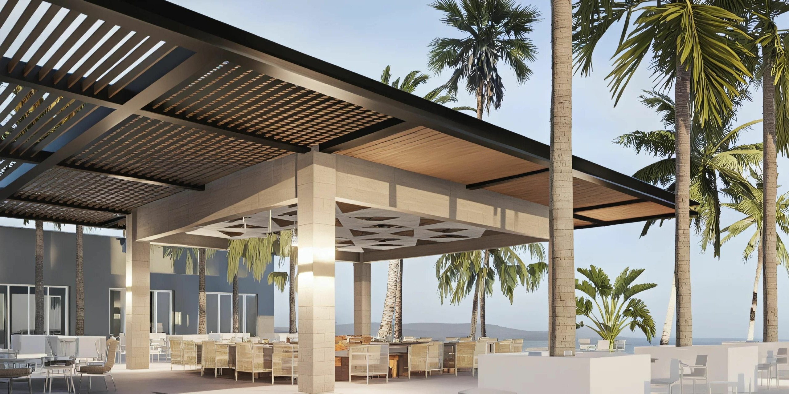 Outdoor dining area with modern wooden pergola and wicker chairs, surrounded by palm trees and a view of the ocean in the background.