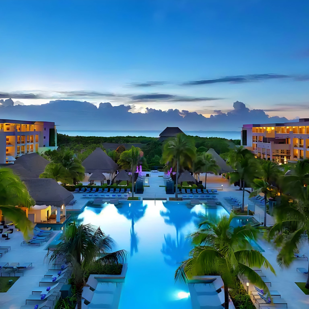 An aerial view of Paradisus Playa del Carmen La Perla at dusk.