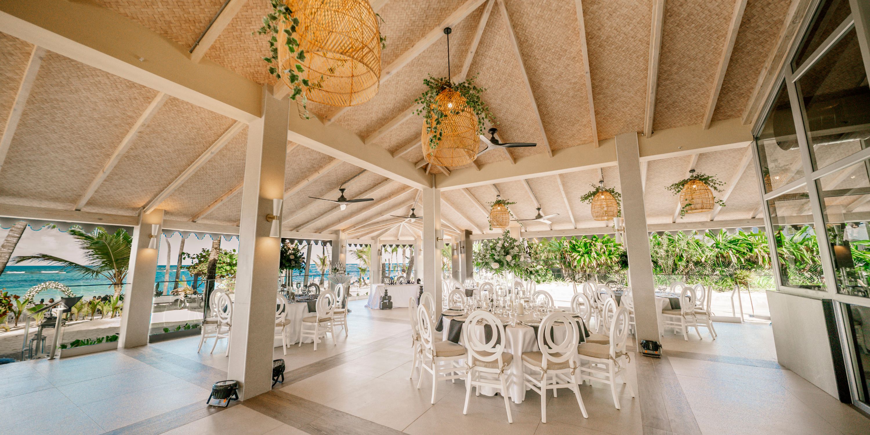 Hotel Riu Palace Macao's open-air dining is perfect for a destination wedding, with round tables and wicker lights.