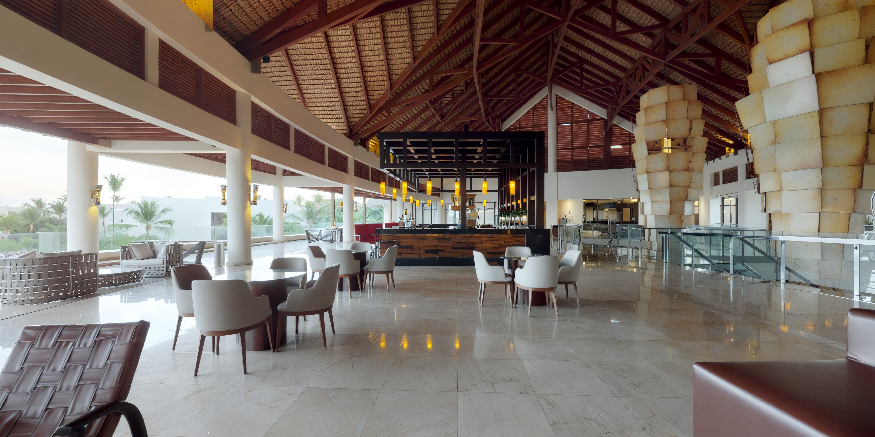 The lobby at Royalton Punta Cana is a spacious setting, featuring a high wooden ceiling complemented by an array of chairs and tables, making it an ideal gathering spot for your destination wedding.