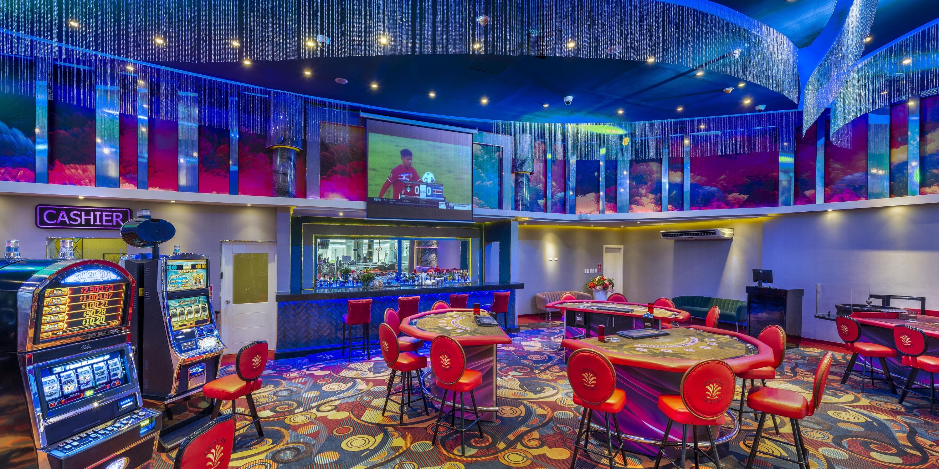 Royalton CHIC Punta Cana casino—ideal for destination weddings, with gaming tables and red chairs.