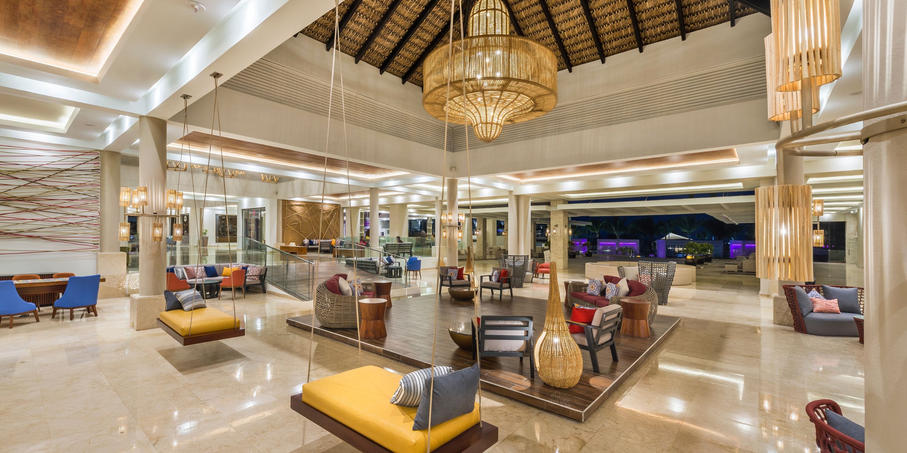 Royalton CHIC Punta Cana: chic lobby perfect for a destination wedding, with swings and chandelier.