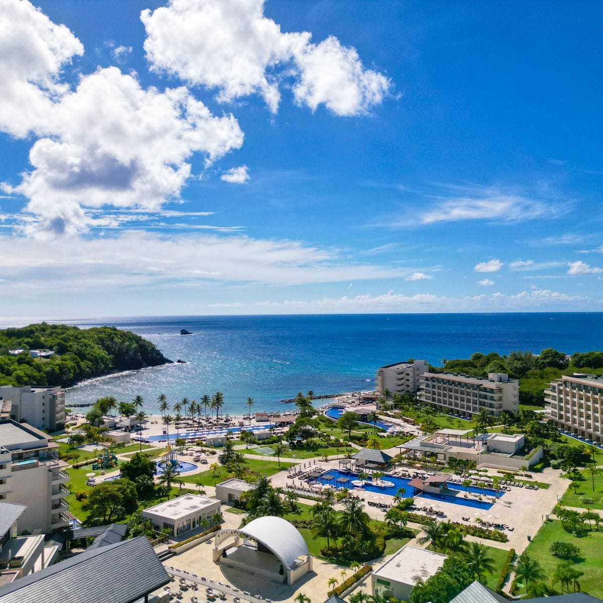 Aerial view of Royalton St. Lucia Resort, ideal for a destination wedding, with pools and palm trees.