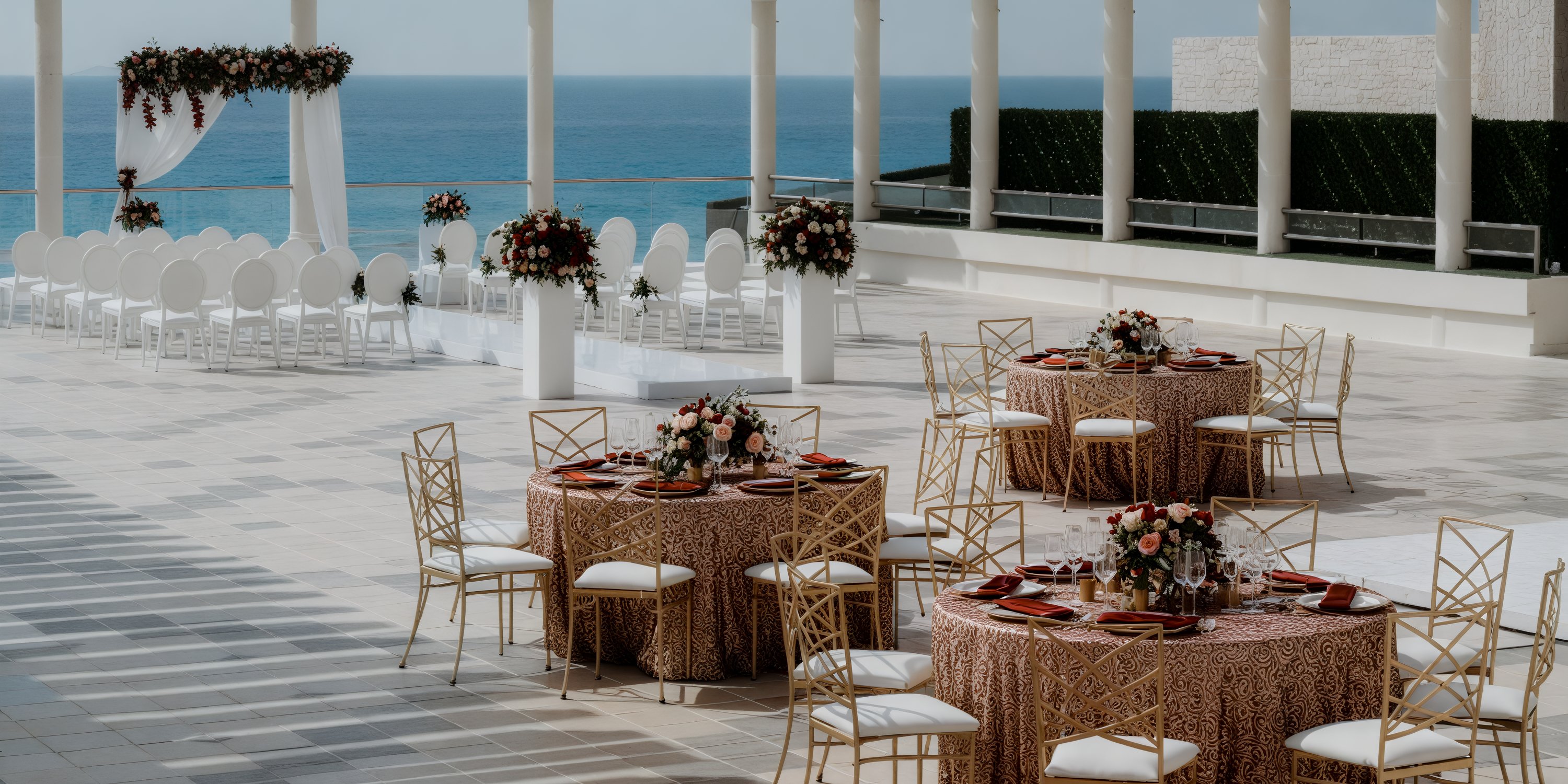 Beach destination wedding setup at Sandos Cancun featuring round tables adorned with floral decor.