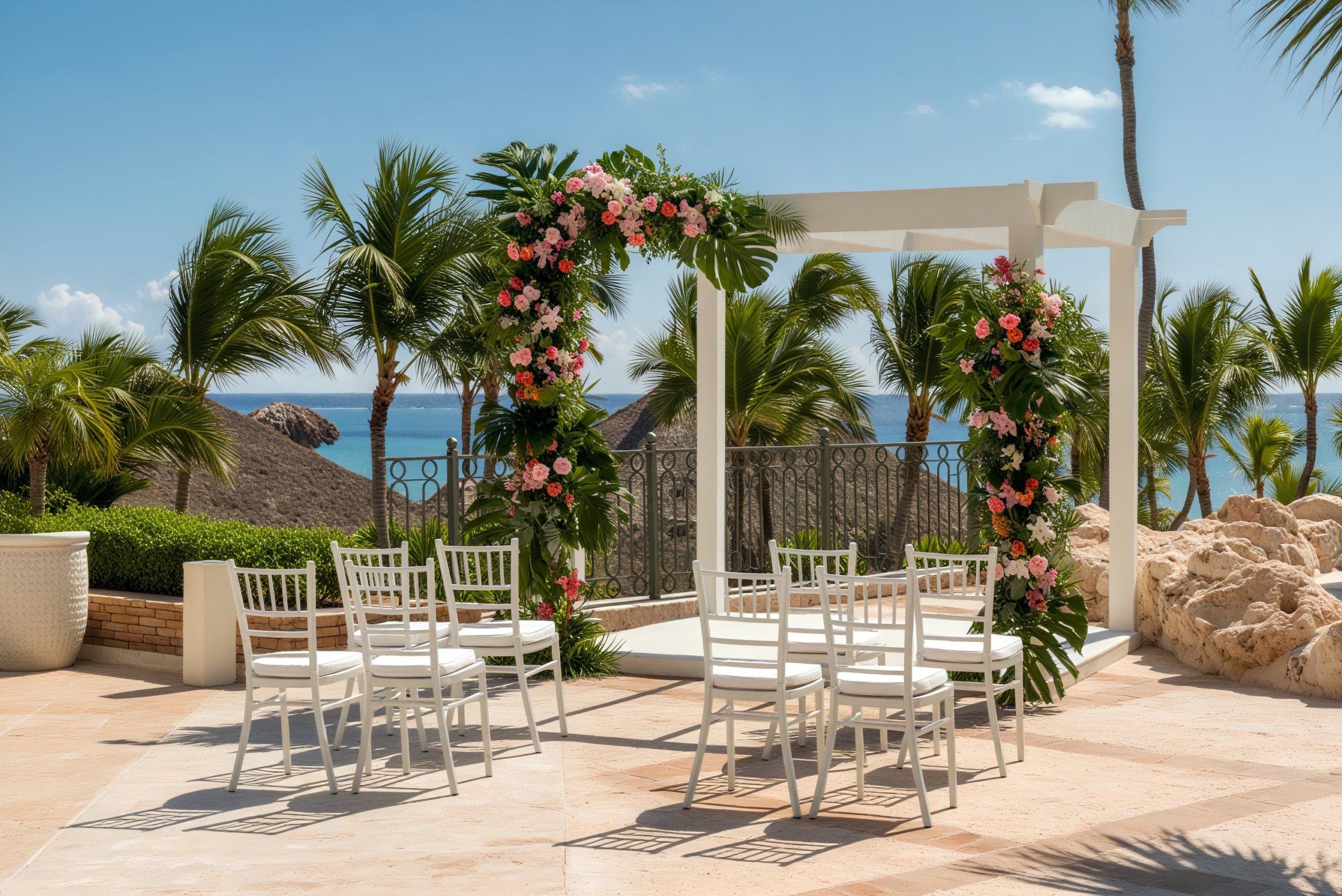 Sanctuary Cap Cana: An idyllic setting for a destination wedding, featuring an outdoor arch adorned with florals and rows of white chairs arranged perfectly for the occasion.