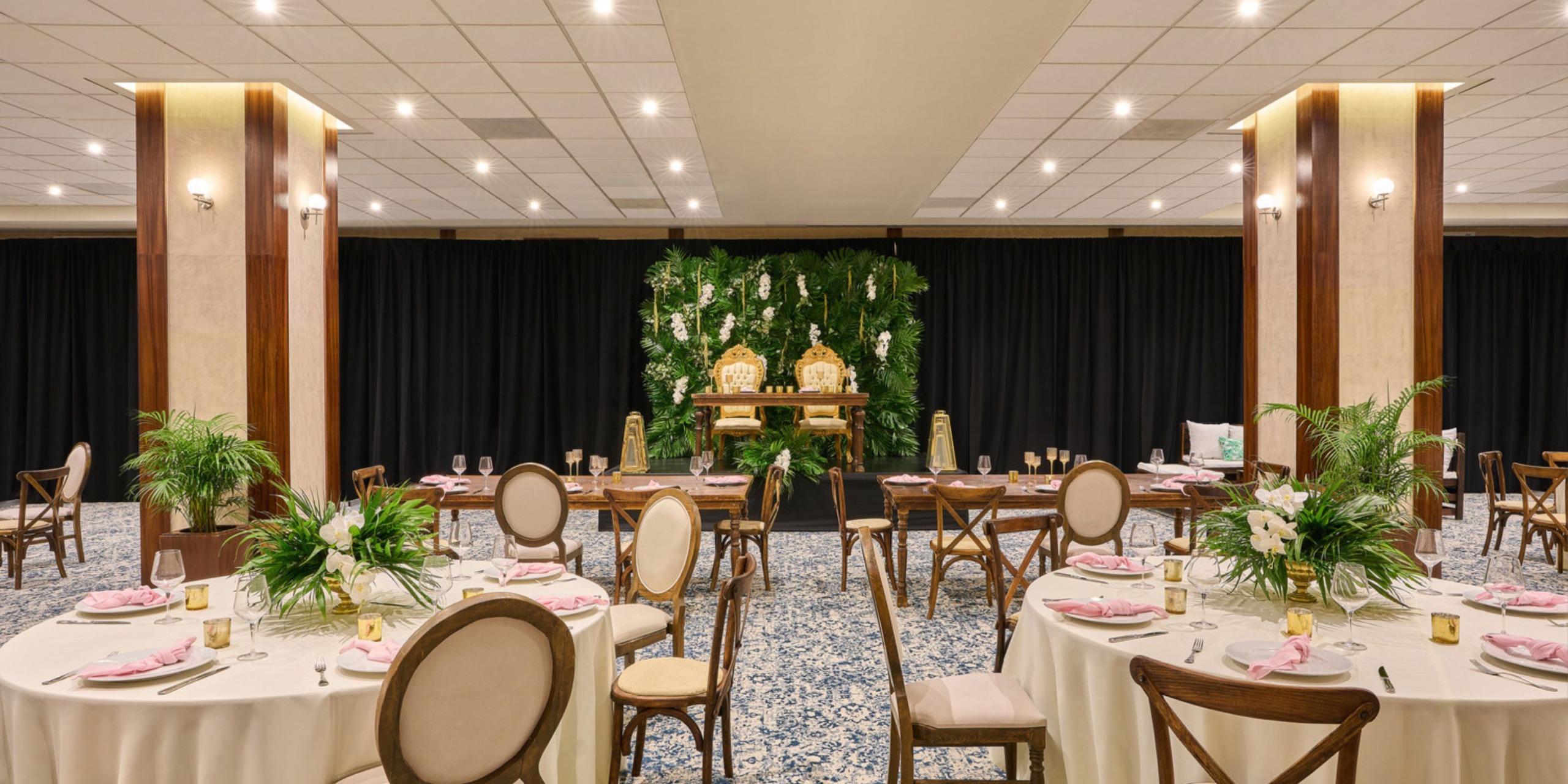 Wyndham Alltra Vallarta boasts an elegant banquet hall, complete with round tables and floral decor, making it a perfect venue for a destination wedding.