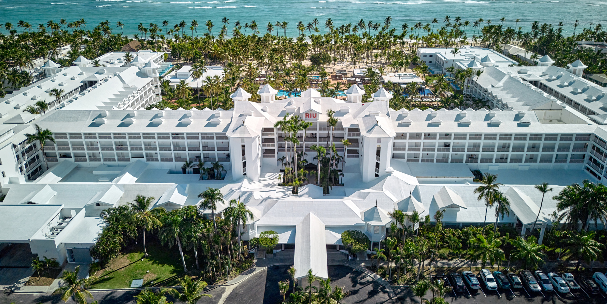 Sentence with Product Name: An aerial view of Hotel Riu Palace Macao on the beach.
