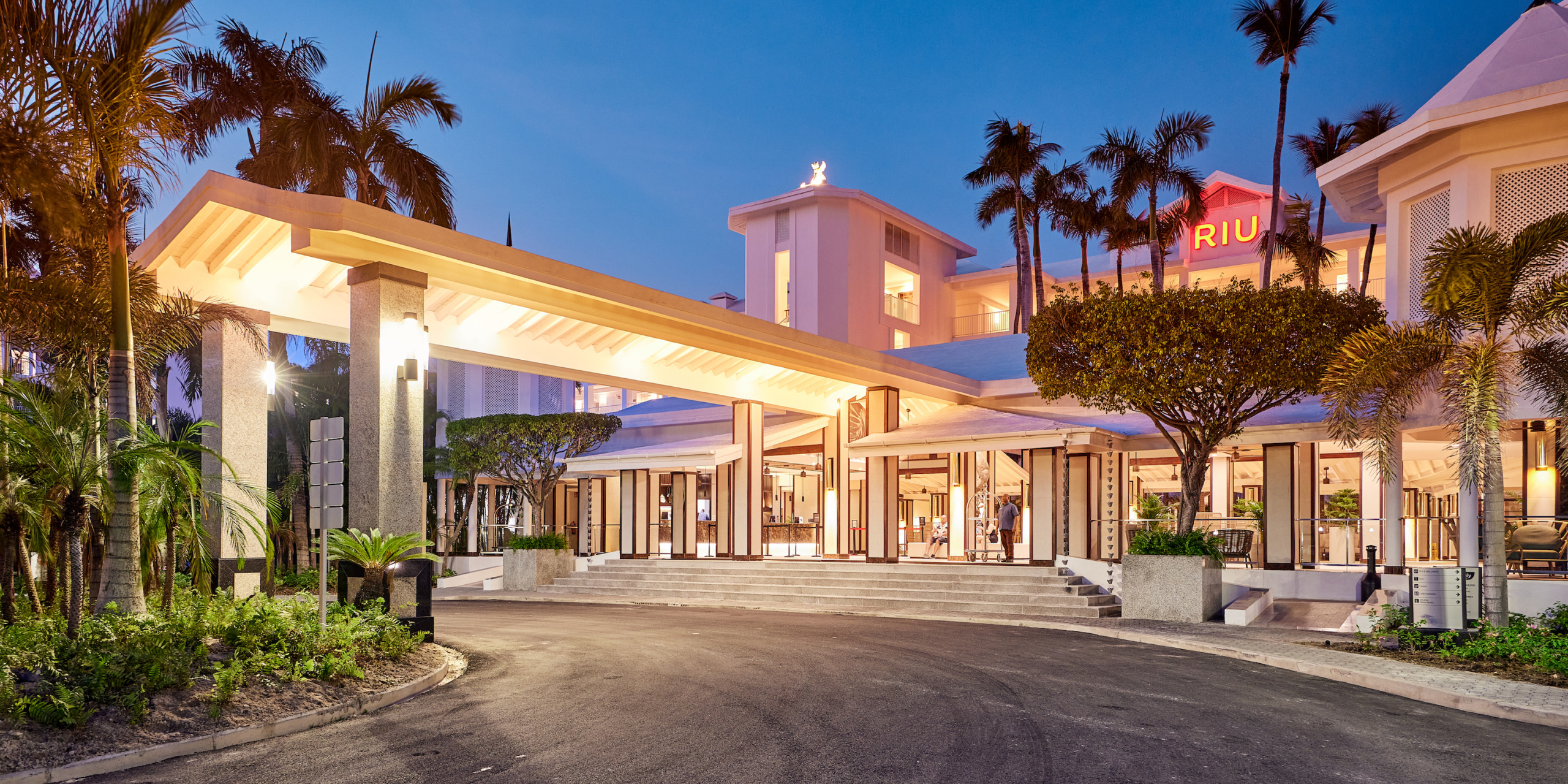 The entrance to Hotel Riu Palace Macao at dusk.