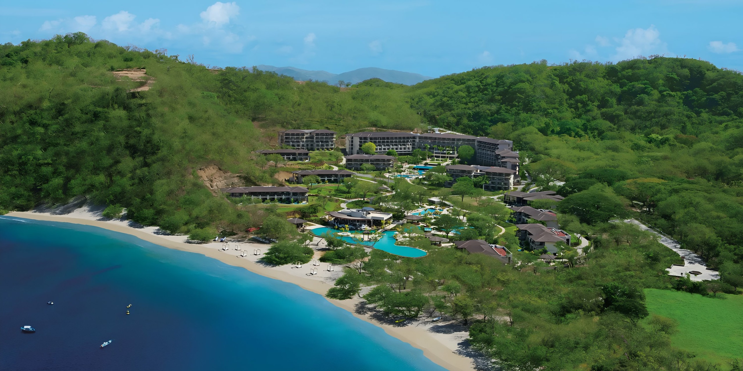 Dreams Las Mareas, a coastal resort with swimming pools beside a tropical beach with clear blue waters.