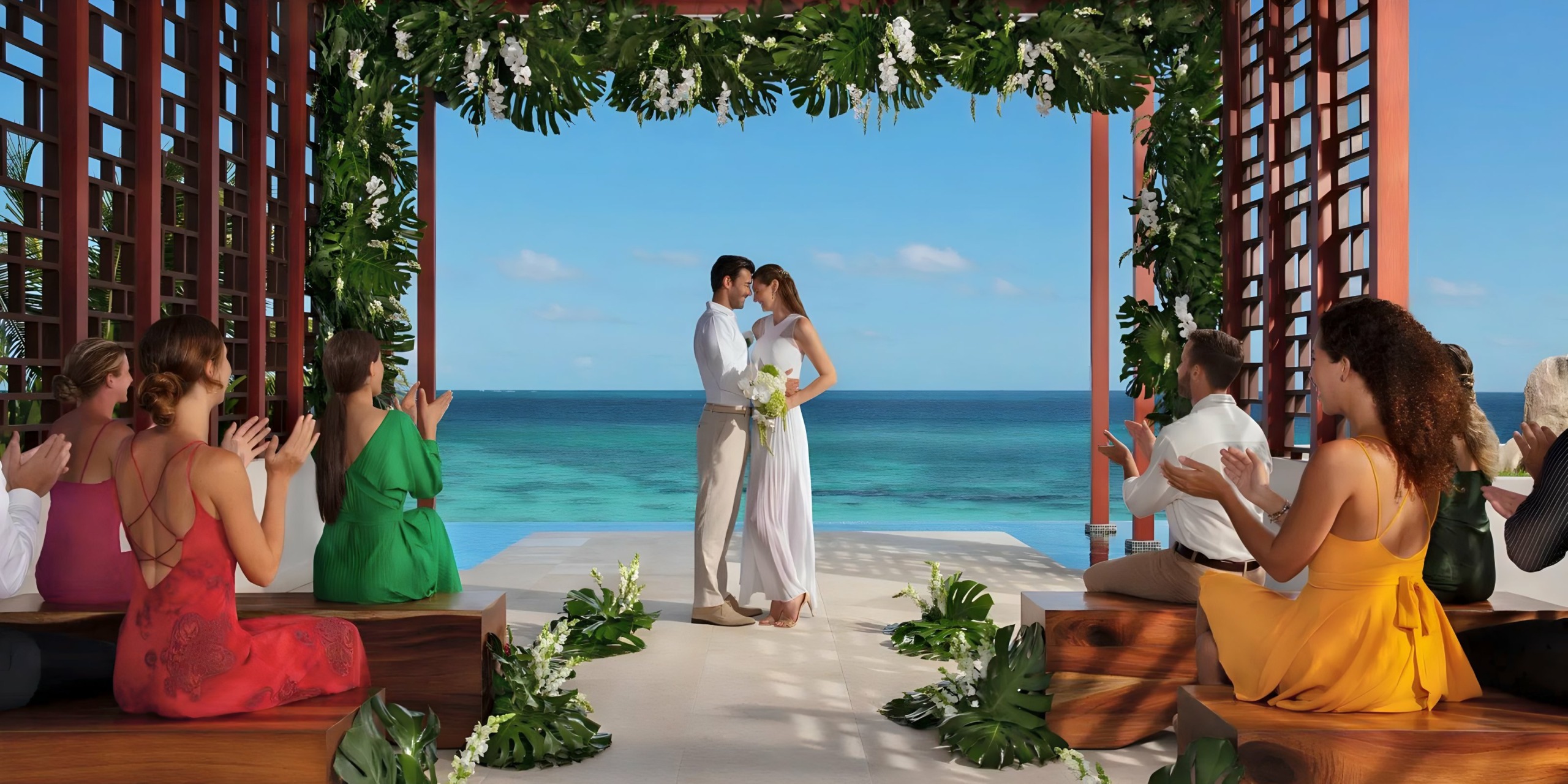 Intimate informal casual destination wedding between a man and a woman on the beach on the ocean at the Pergola at Dreams Jade Riviera Cancun
