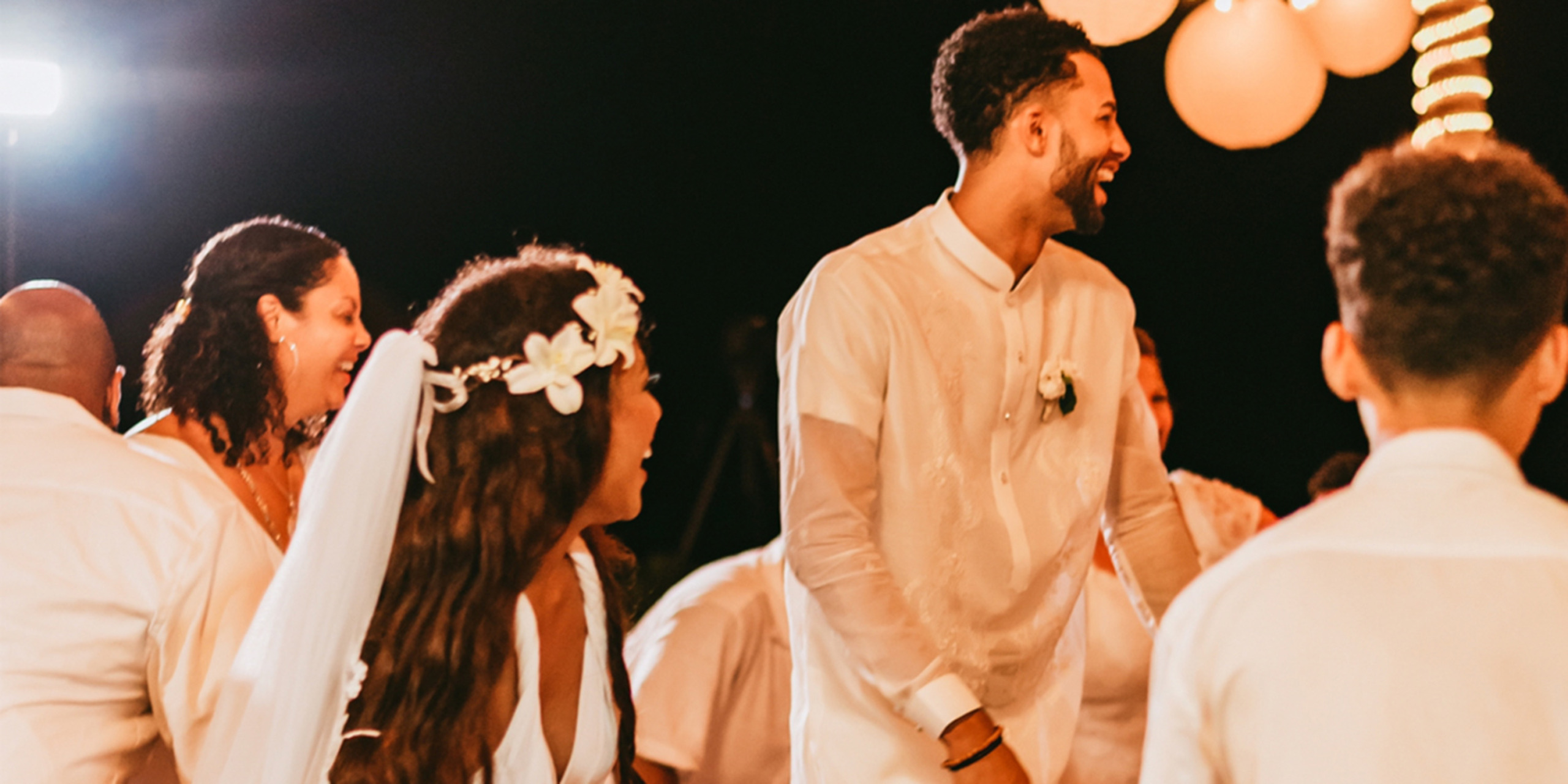 Gabby and Steven celebrate at their destination wedding reception with their friends and guests