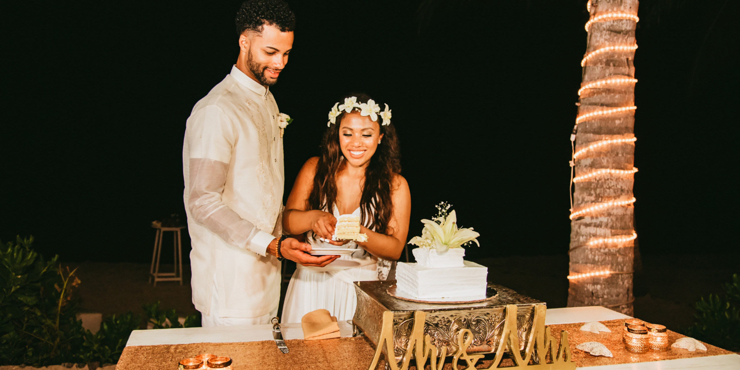 Gabby and Steven cut the cake at their dream destination wedding