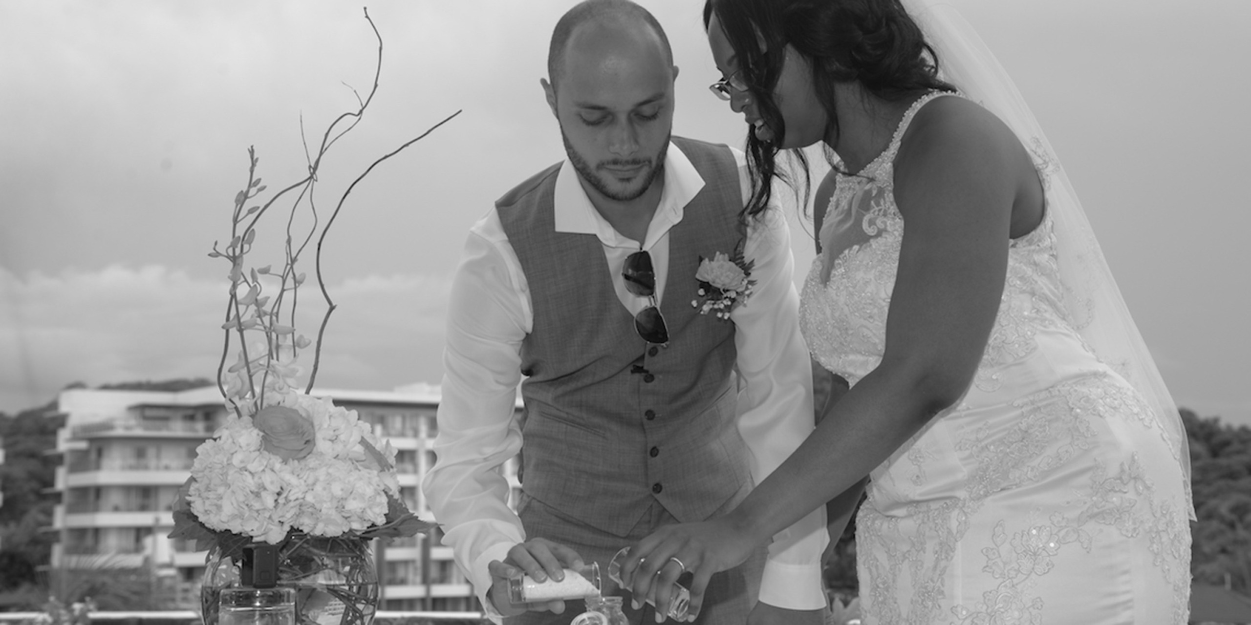 ndia and Igor perform the unity sand ceremony is a tradition in which a couple pours sand from separate vessels into a unified, central one.
