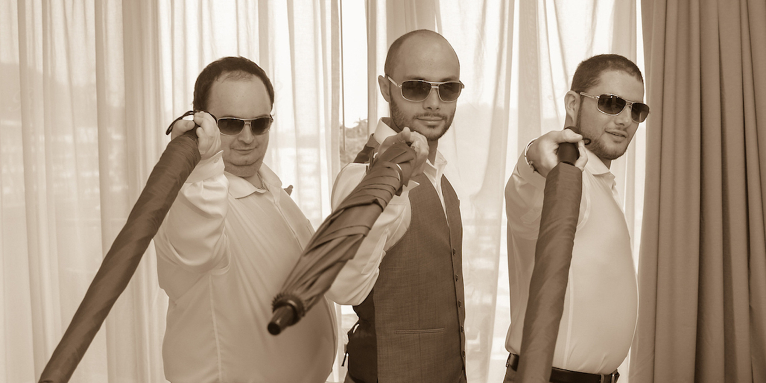 igor poses with his groomsmen at the dream destination wedding of India and Igor