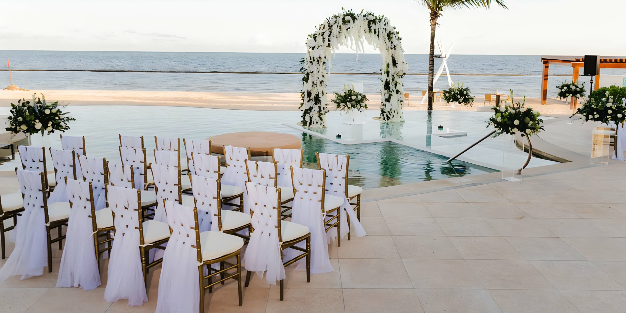 A wedding ceremony set up in front of Breathless Riviera Cancún Resort & Spa.