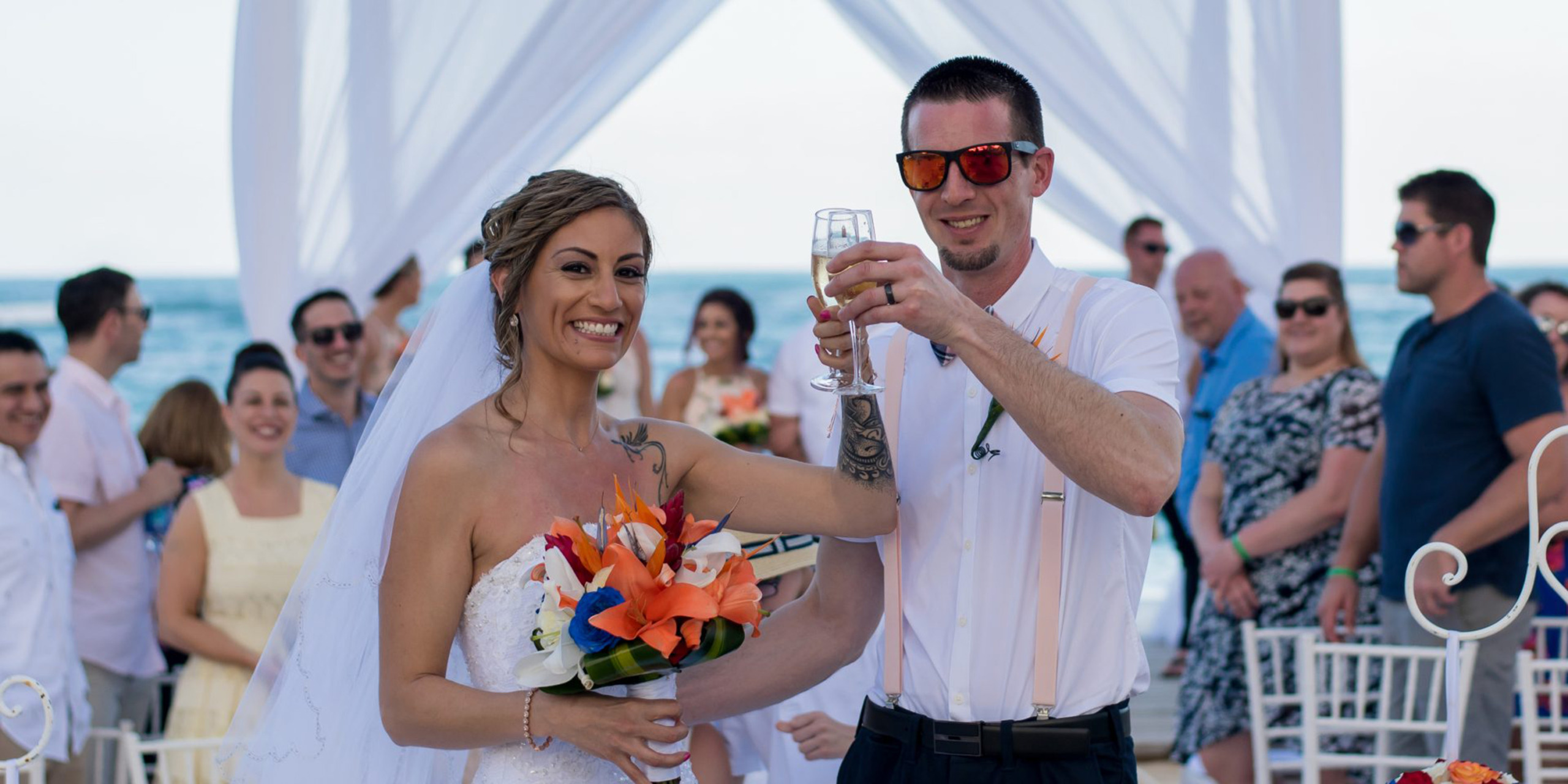 Sonja and Eric toast champagne after they wed during their wedding receptionnn