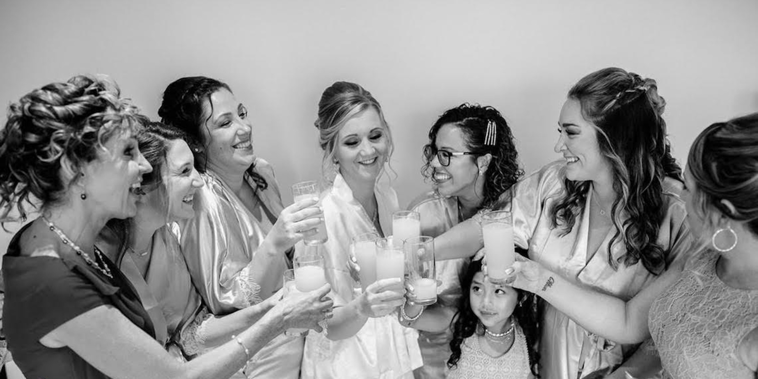 Tiana and Jessica raise a toast with their friends