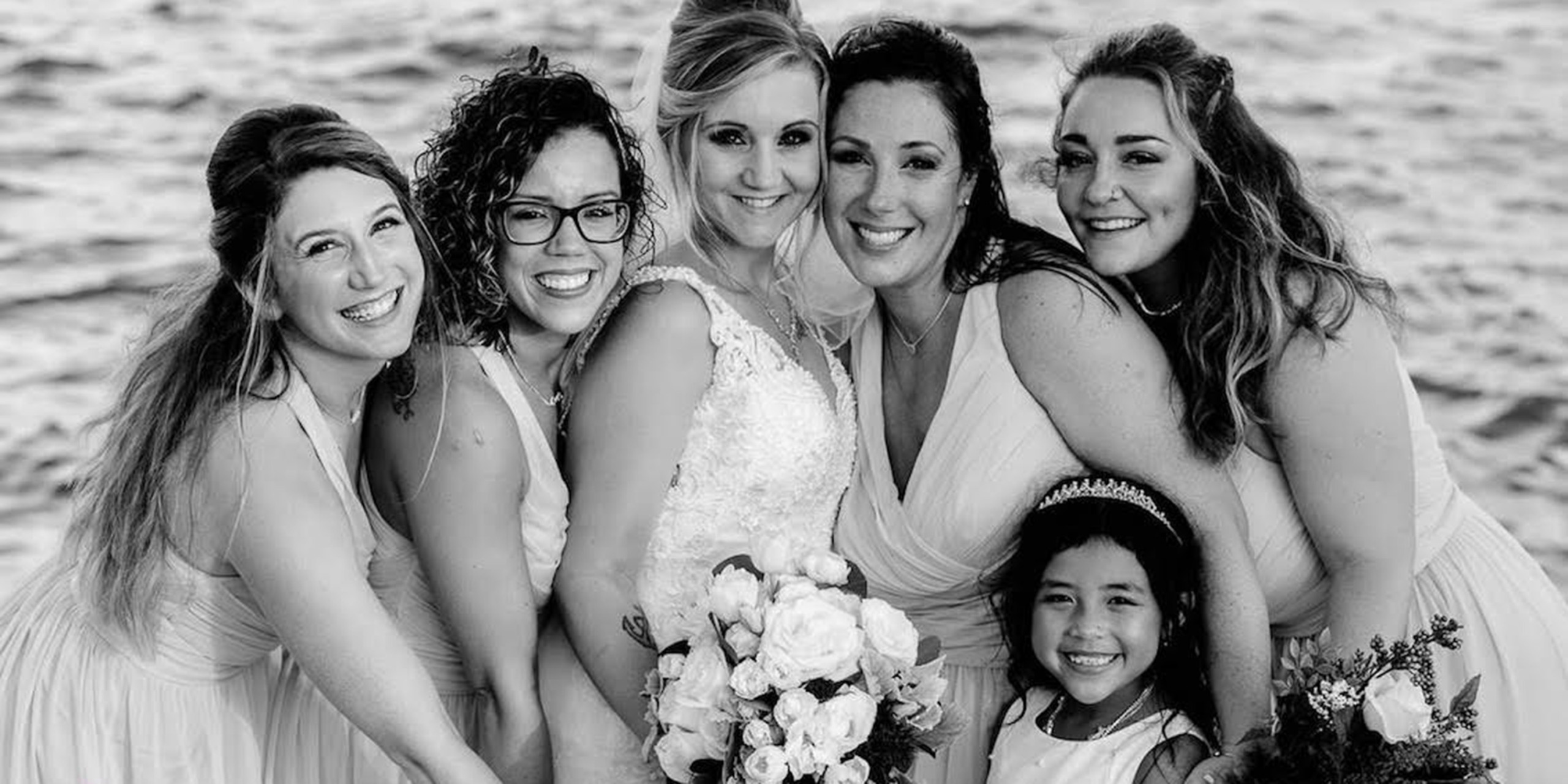 Tiana and Jessica pose with their wedding party