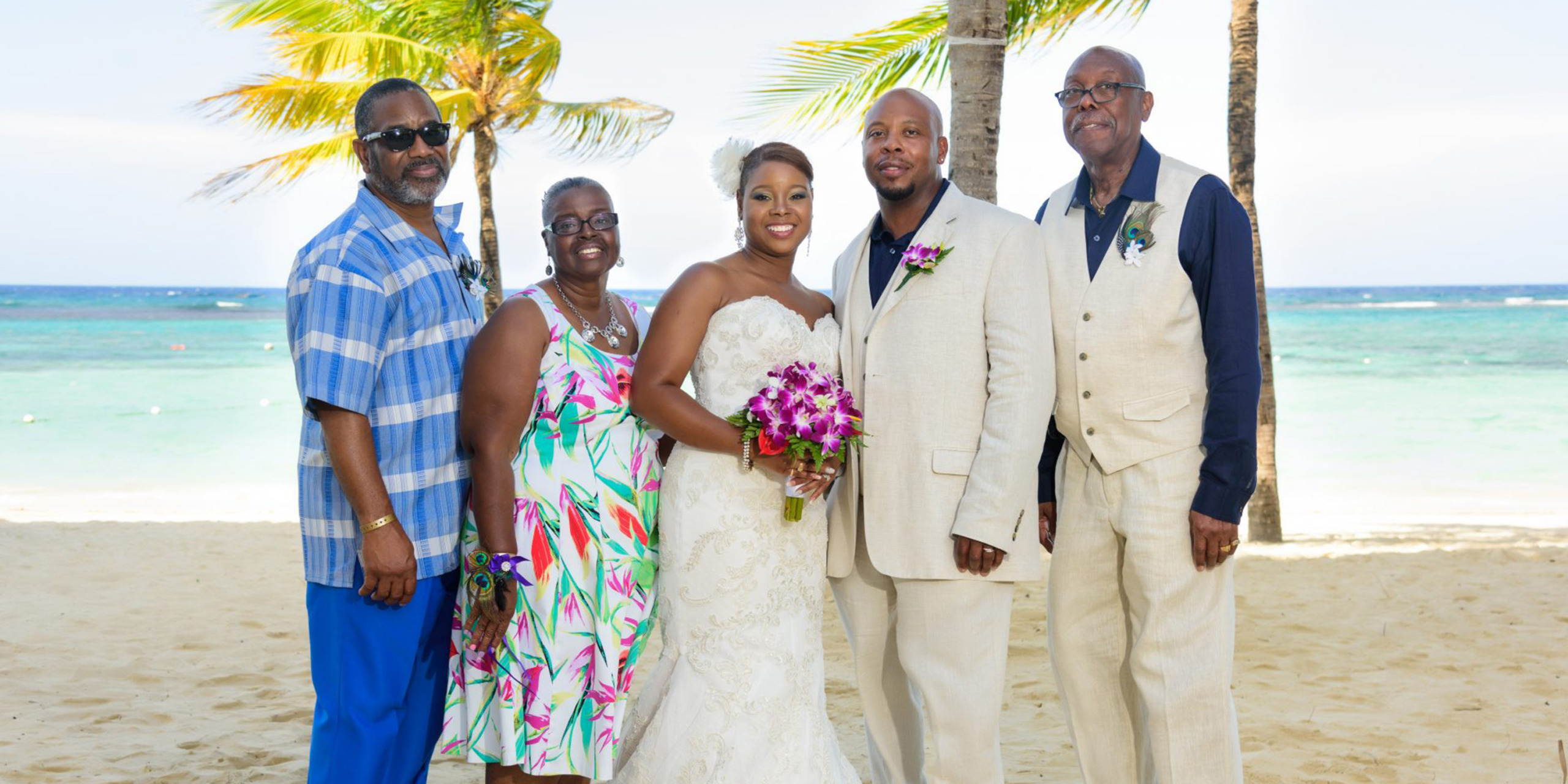 Tonya and Omar pose with their parents