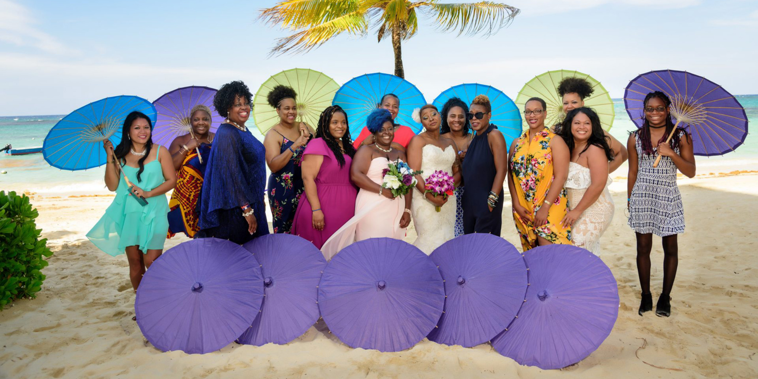 Colorful umbrellas photoshoot of the wedding party and family at the Tonya and Omar wedding