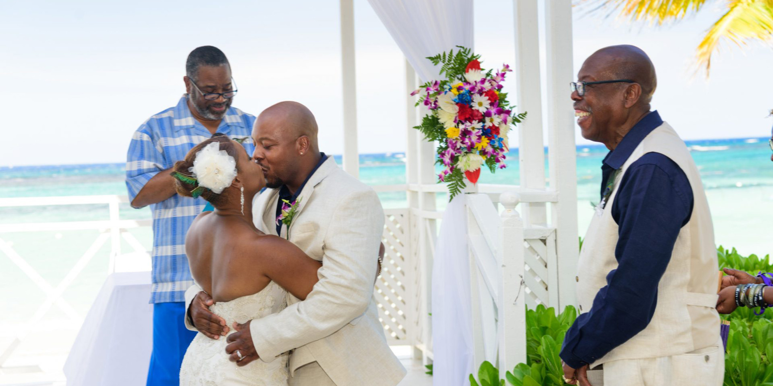 Tonya and Omar kiss while dad laughs